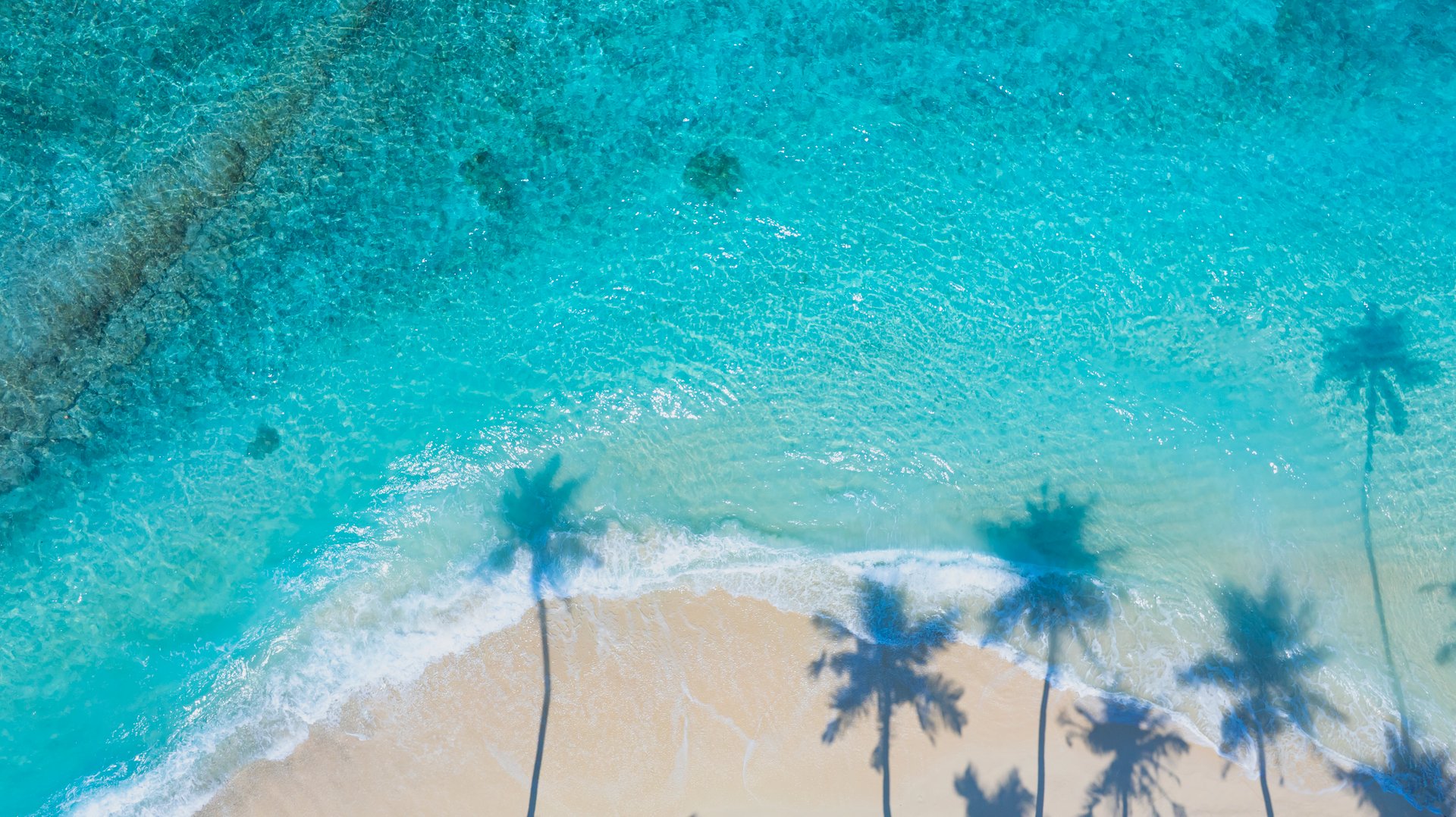 Aerial view of Cancun's pristine beaches and turquoise waters