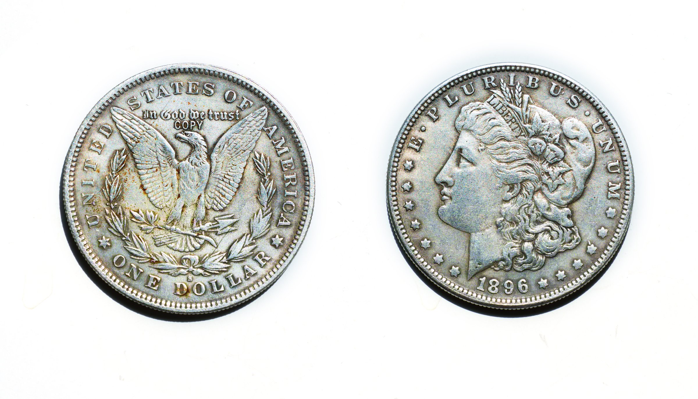 Obverse and reverse views of a souvenir historical 1896 silver dollar coin