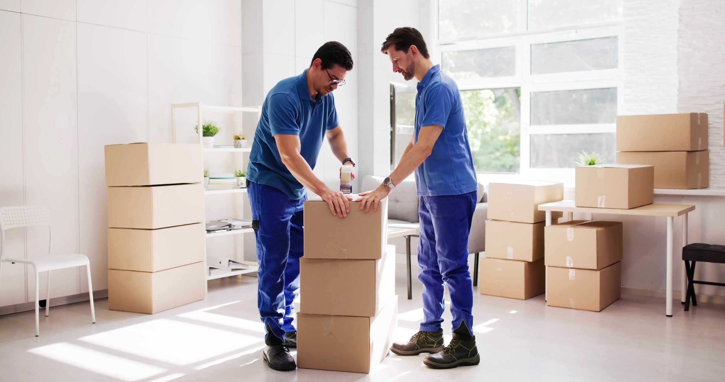 Hardworking Hispanic Movers Expertly Pack And Move Residential Furniture Items.