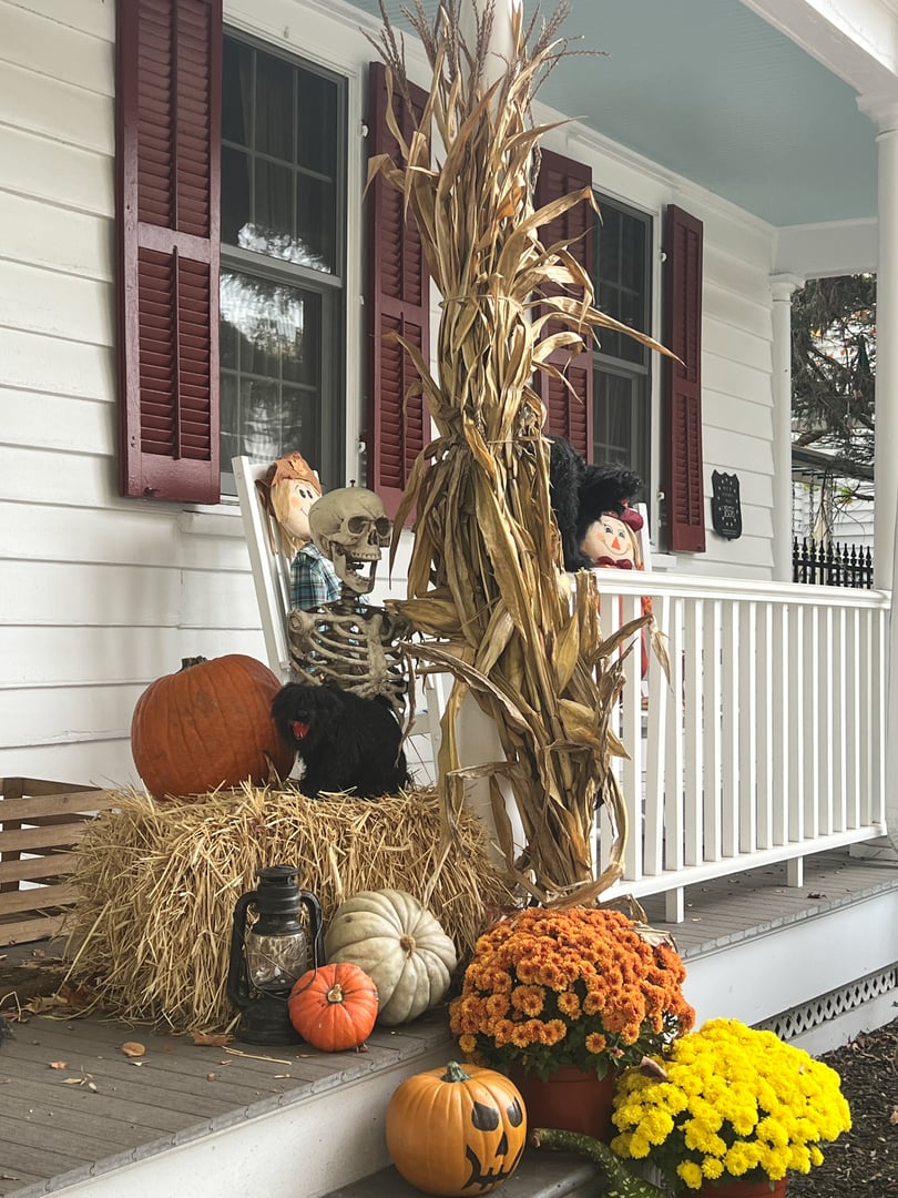 USA, Cranbury, New Jersey, October 27, 2023 Halloween decoration on porch with pumpkins and scarecrows.
