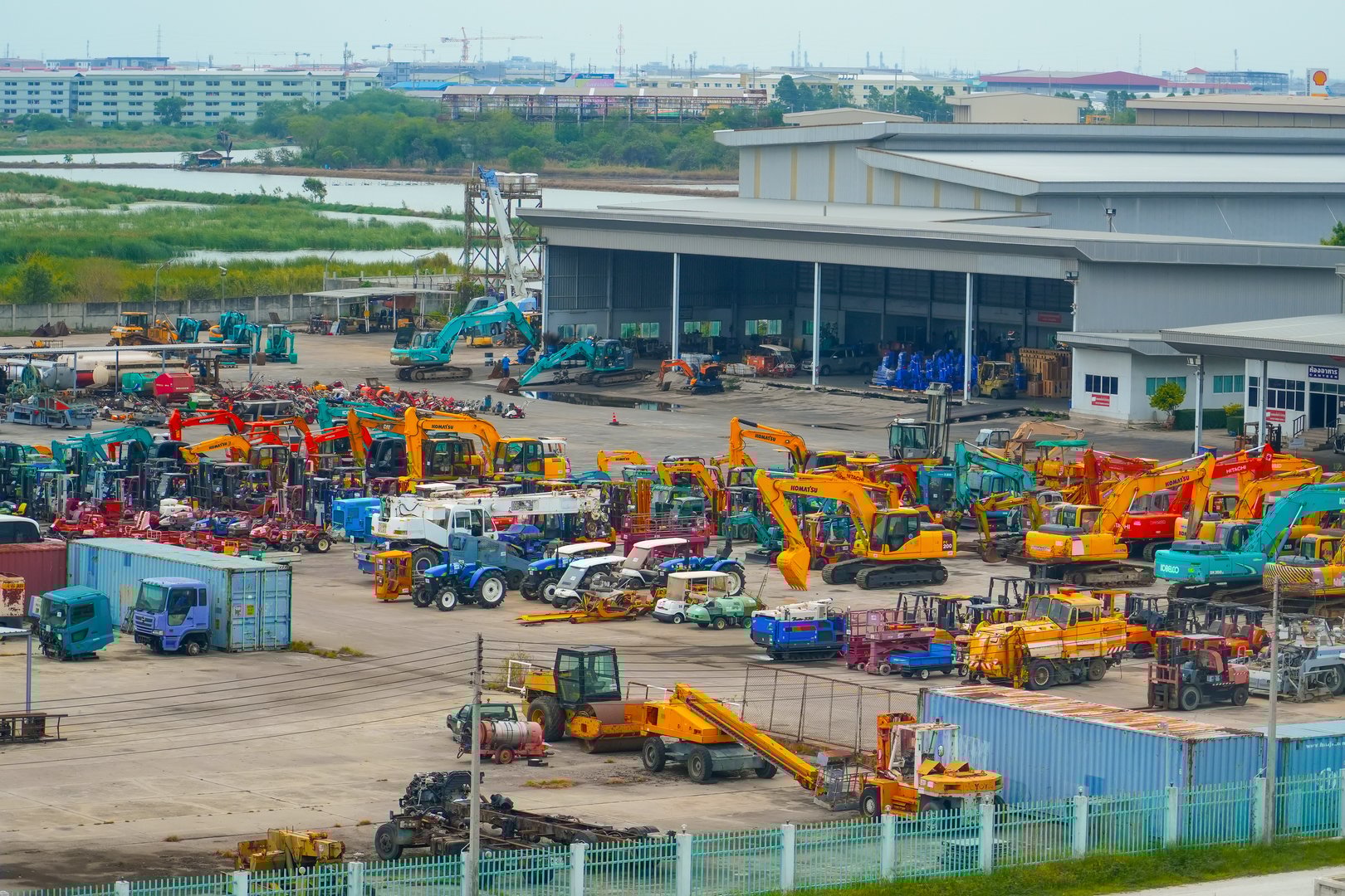 Multiple cars, excavators, bulldozers, tractors, machinery, trucks Komatsu, Cat, Hitachi, Doosan, Kobelco, Sany. Thailand, Bangkok. 13 May 2024