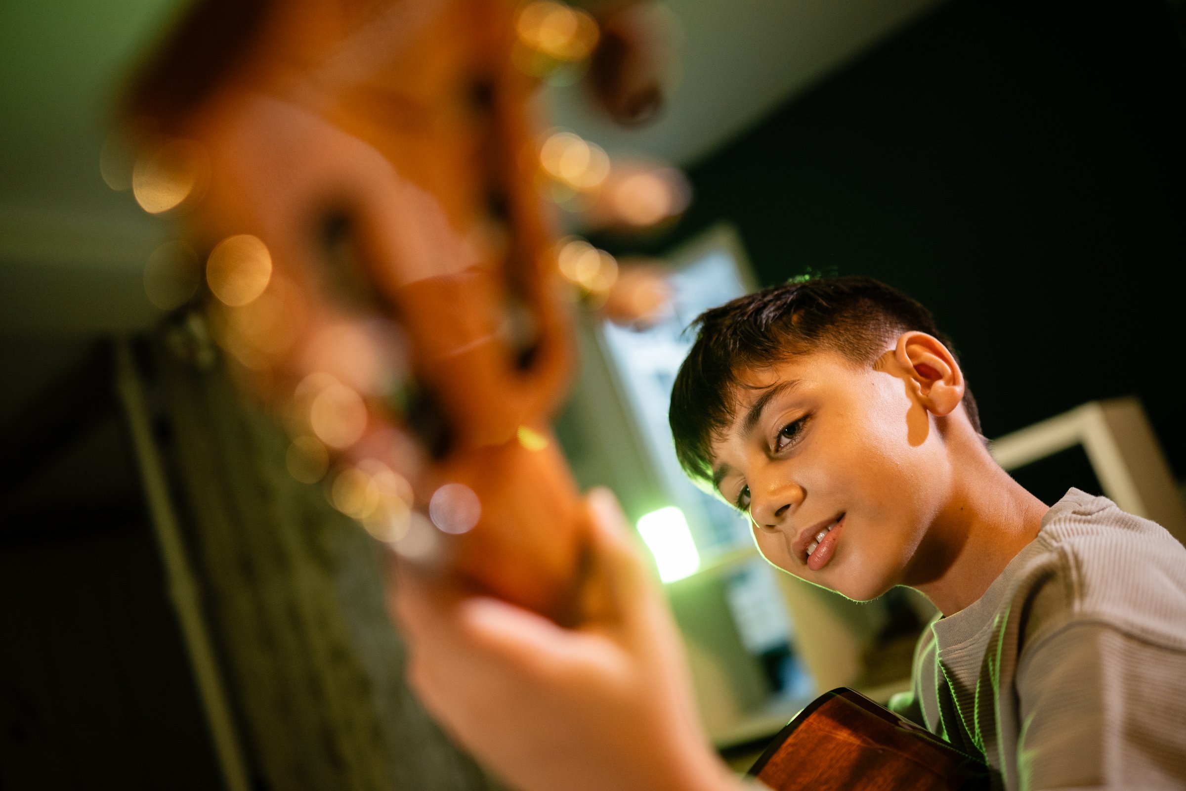 Young boy playing guitar