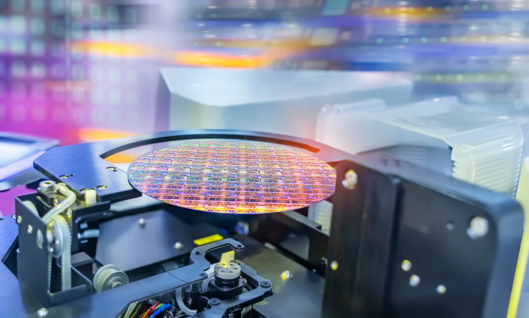 Semiconductor and Computer Chip Manufacturing at Fab or Foundry with robotic arms with silicon wafers