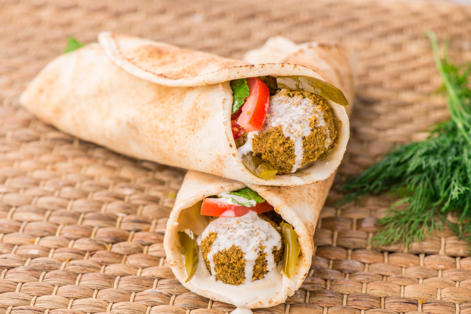 Tortilla Falafel shawarma wrap served in dish isolated on table side view of arabic food