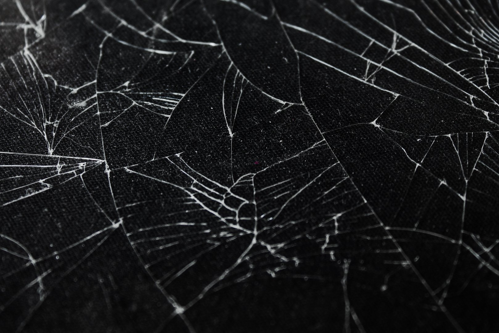 The pattern on the glass is cracked. damage to the glass.  cracked texture