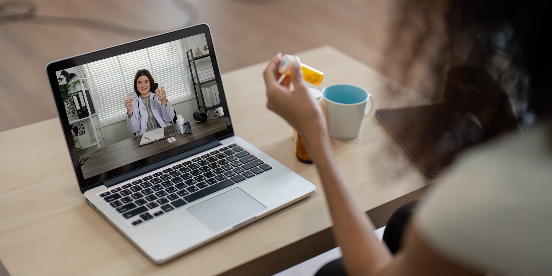 A patient consults two healthcare professionals via video, discussing medication options and receiving crucial guidance in a comfortable setting.