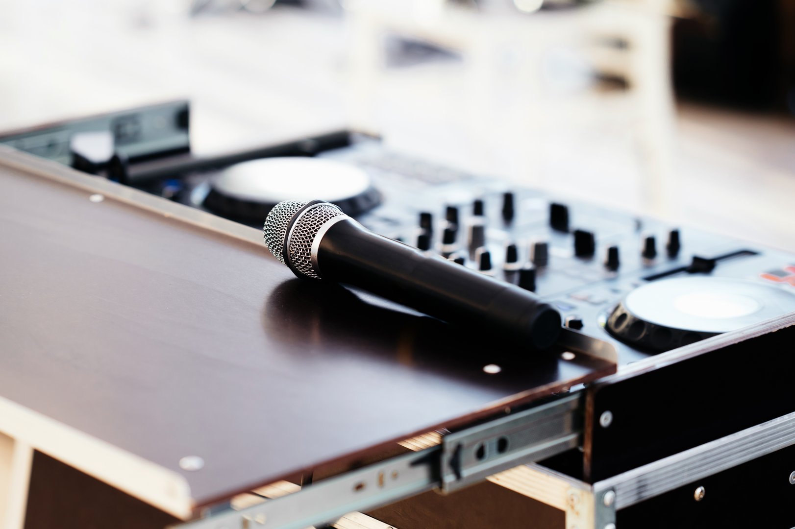 A closeup of a premium microphone on DJ equipment, perfect for vibrant music events and energetic parties