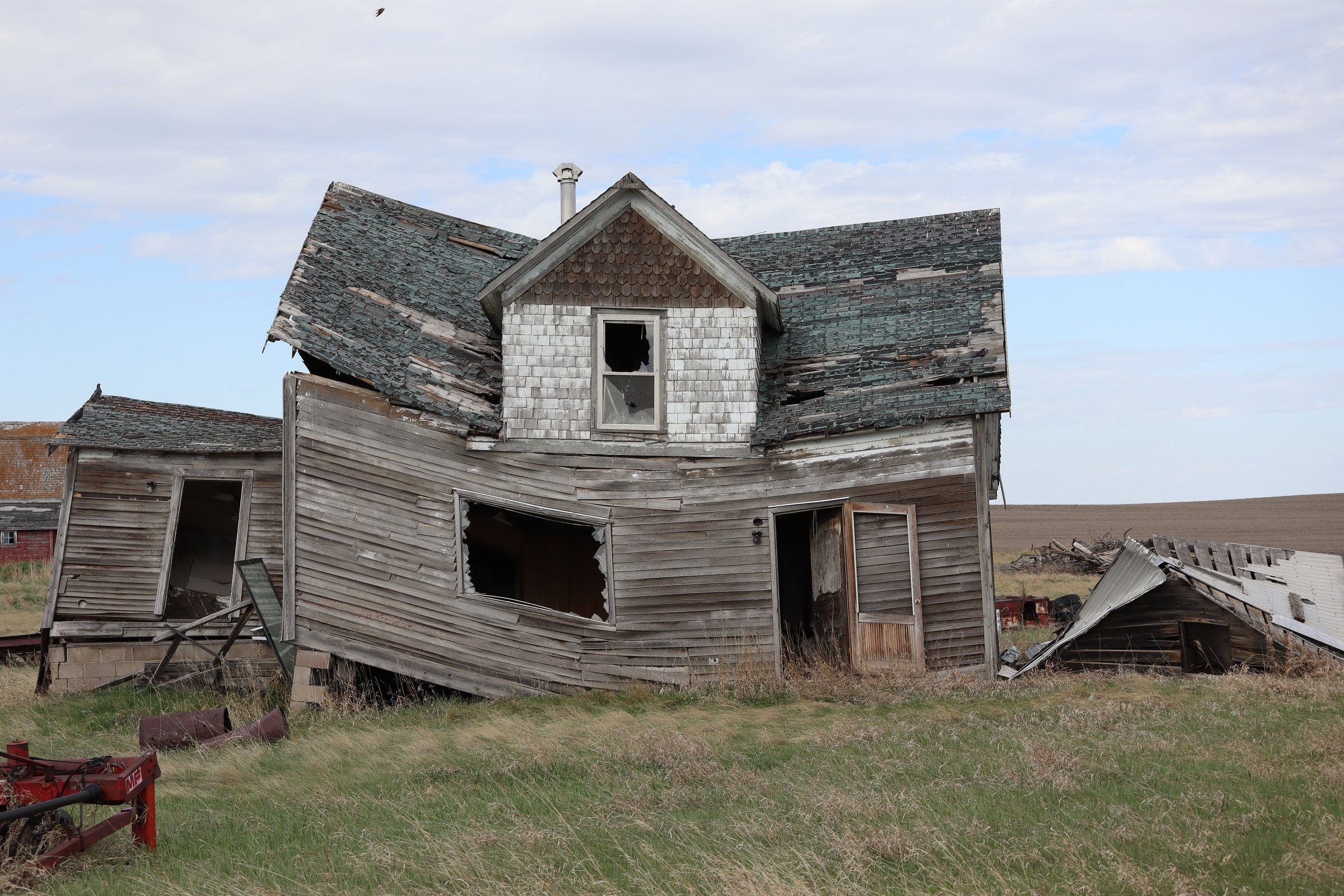 The old house is slanted and falling over because of it has been abandoned and neglected. The prairie history attached to the old building will forever be lost.