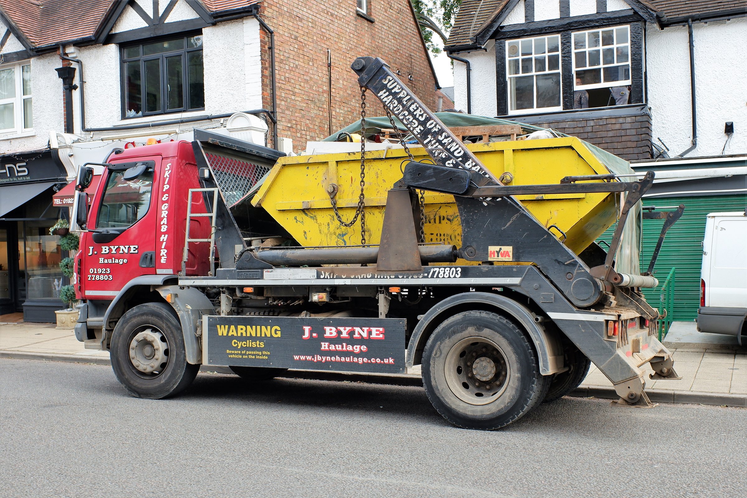 Chorleywood, Hertfordshire, England, UK - September 30th 2020: DAF skip loader truck belonging to J Byne Haulage Limited of Rickmansworth, Hertfordshire