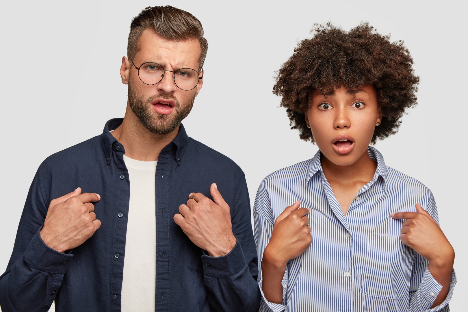 Two people in conflict pointing at themselves