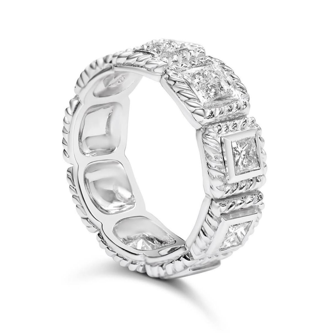 Silver ring with square diamond settings and intricate braided edge design.