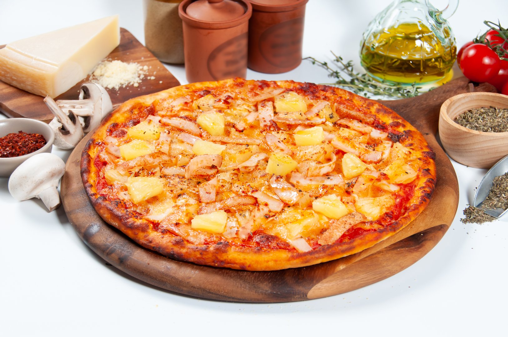 Hawaiian pizza with ham, pineapple, and cherries