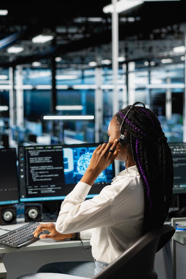 Data center operator providing user technical support, conducting remote diagnostics. Server farm IT expert managing live support calls, identifying hardware issues using predictive AI alerts