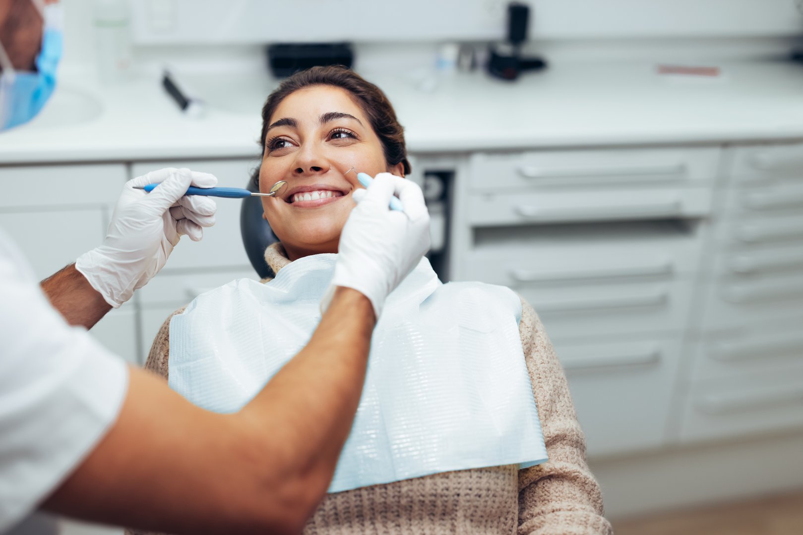 Woman getting dental treatment in modern clinic