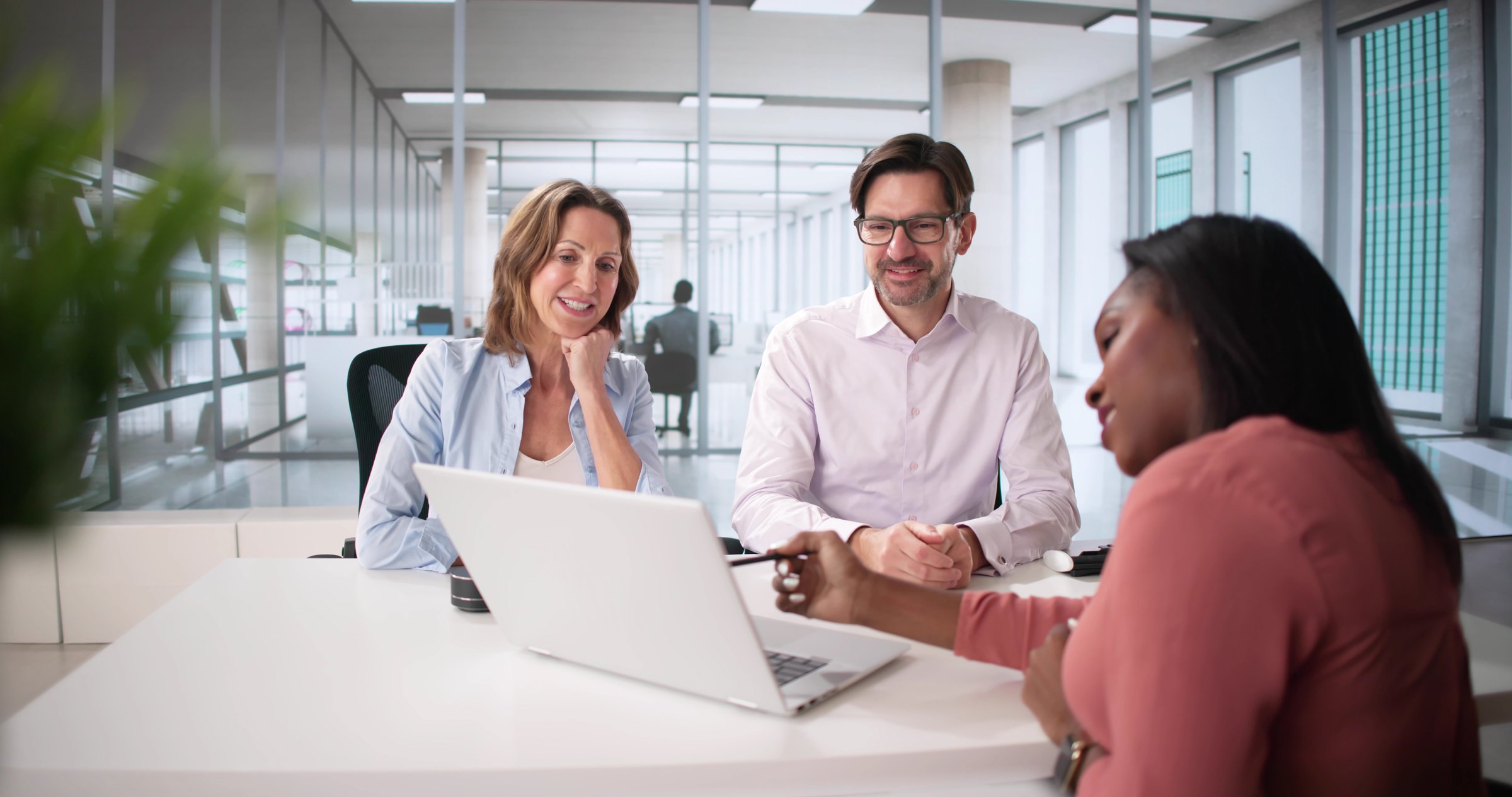 Happy Couple Discussing Financial Planning with Tax Accountant and Consultant