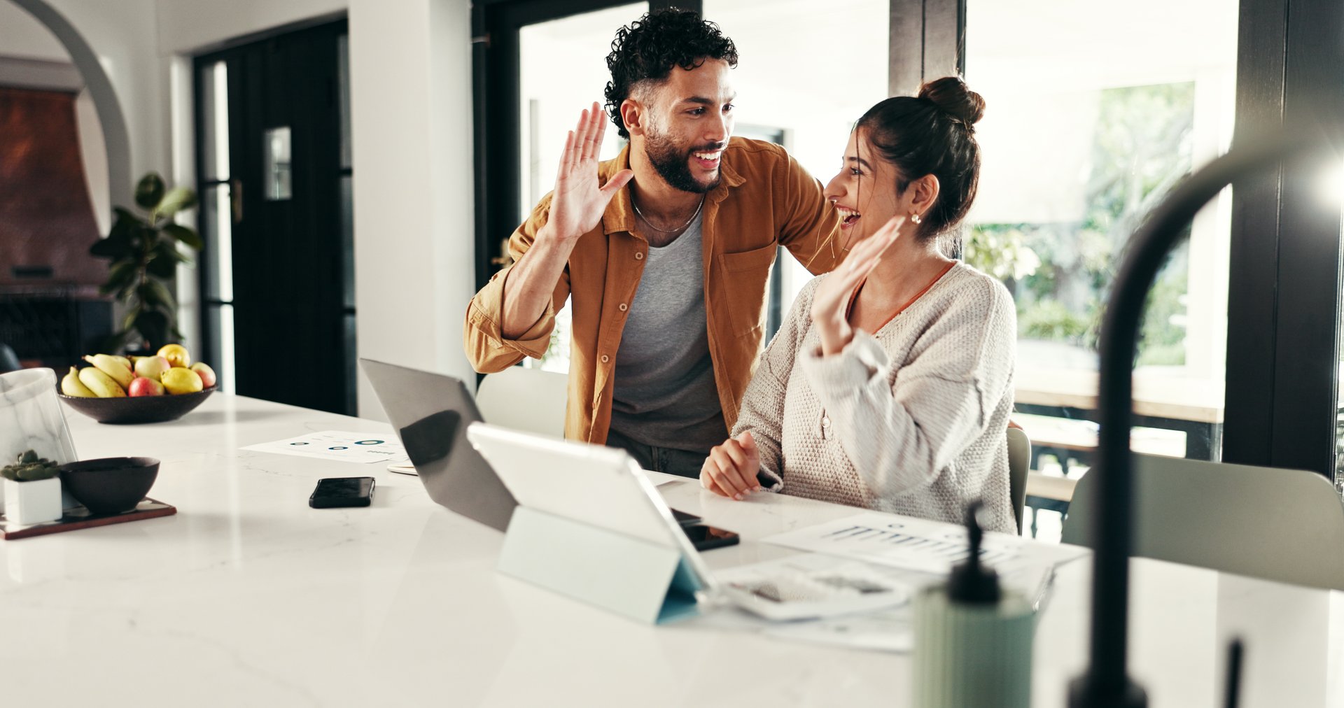 High five, laptop or happy couple celebration for budget goal, success or household bills planning. Paper, profit target or excited people with smile for finance report, stocks growth or salary bonus