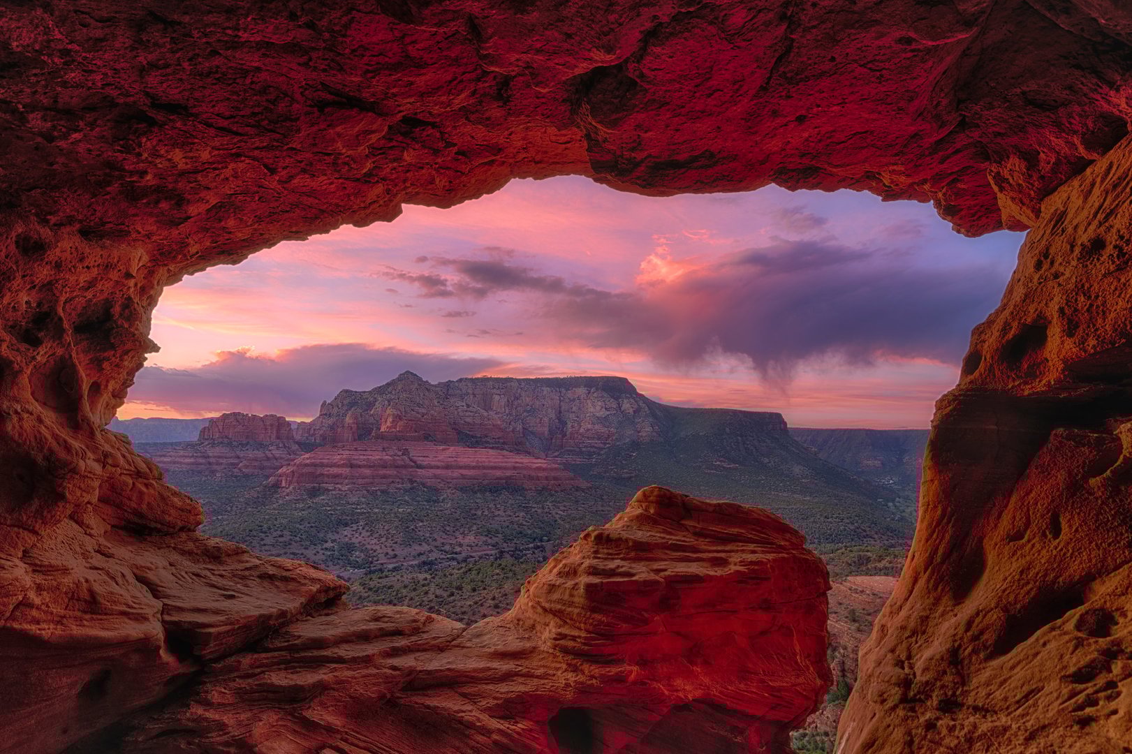 The Sun setting over red rock canyons in Sedona, Arizona