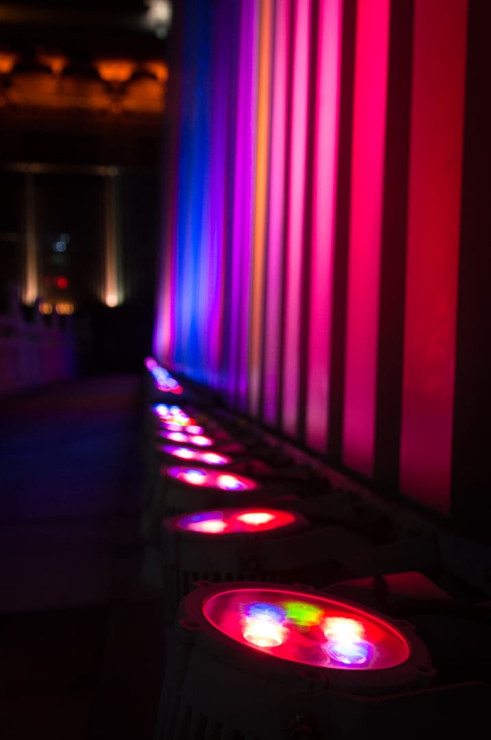 Pink, blue and yellow wall lights.