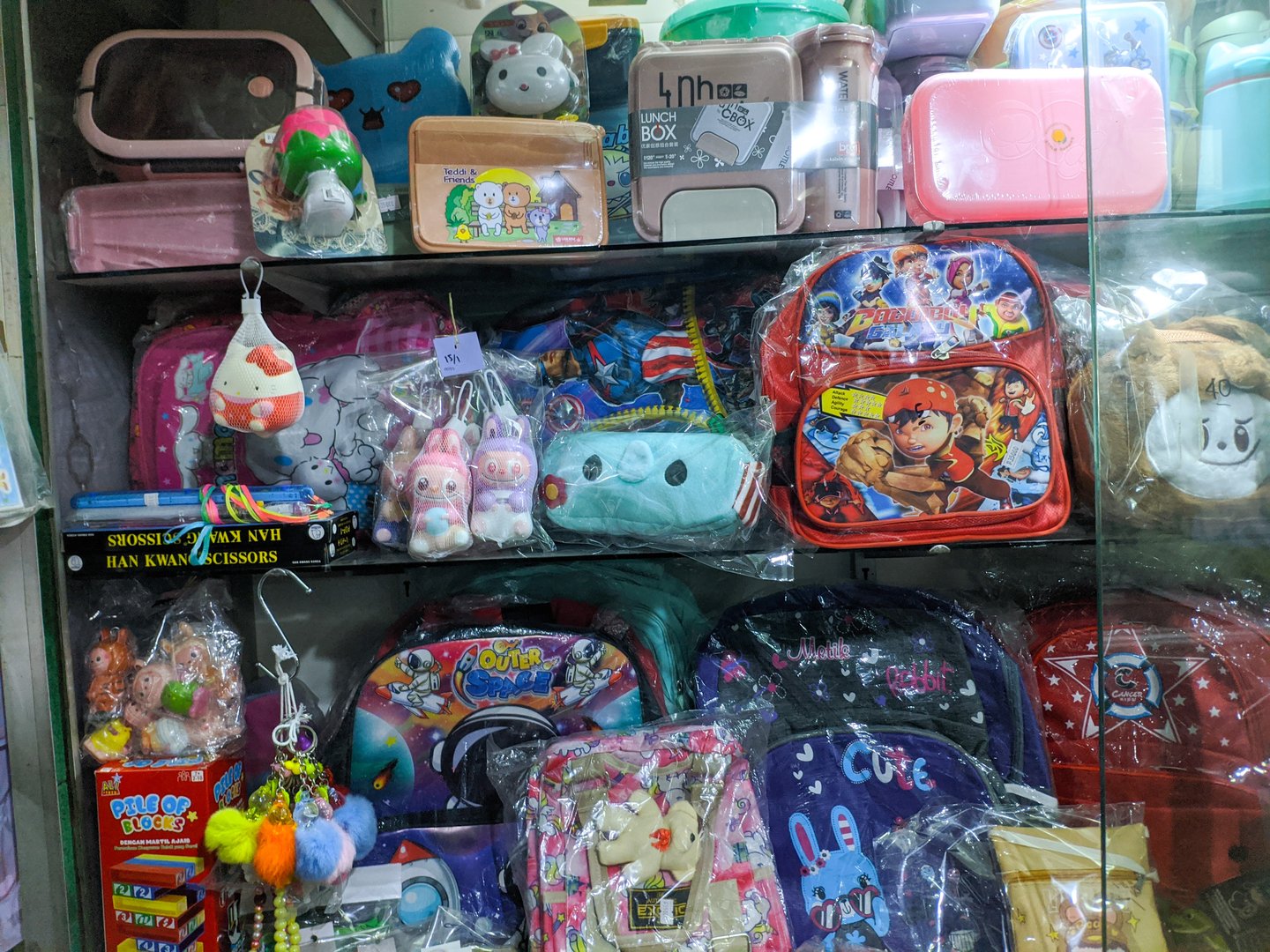 Bandung - January 26, 2025: several cute bags for children's school displayed in the shop window for sale