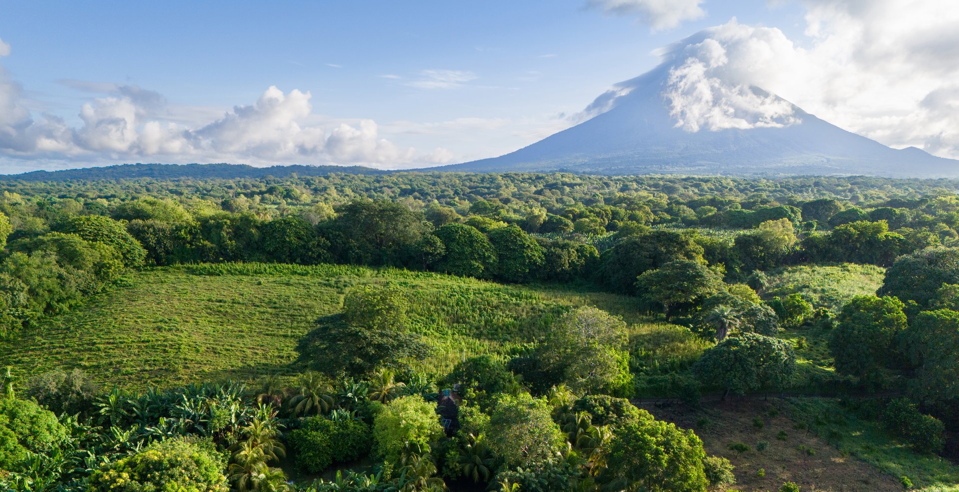 Panorama of green Ometepe island with volcano landscape aerial drone view