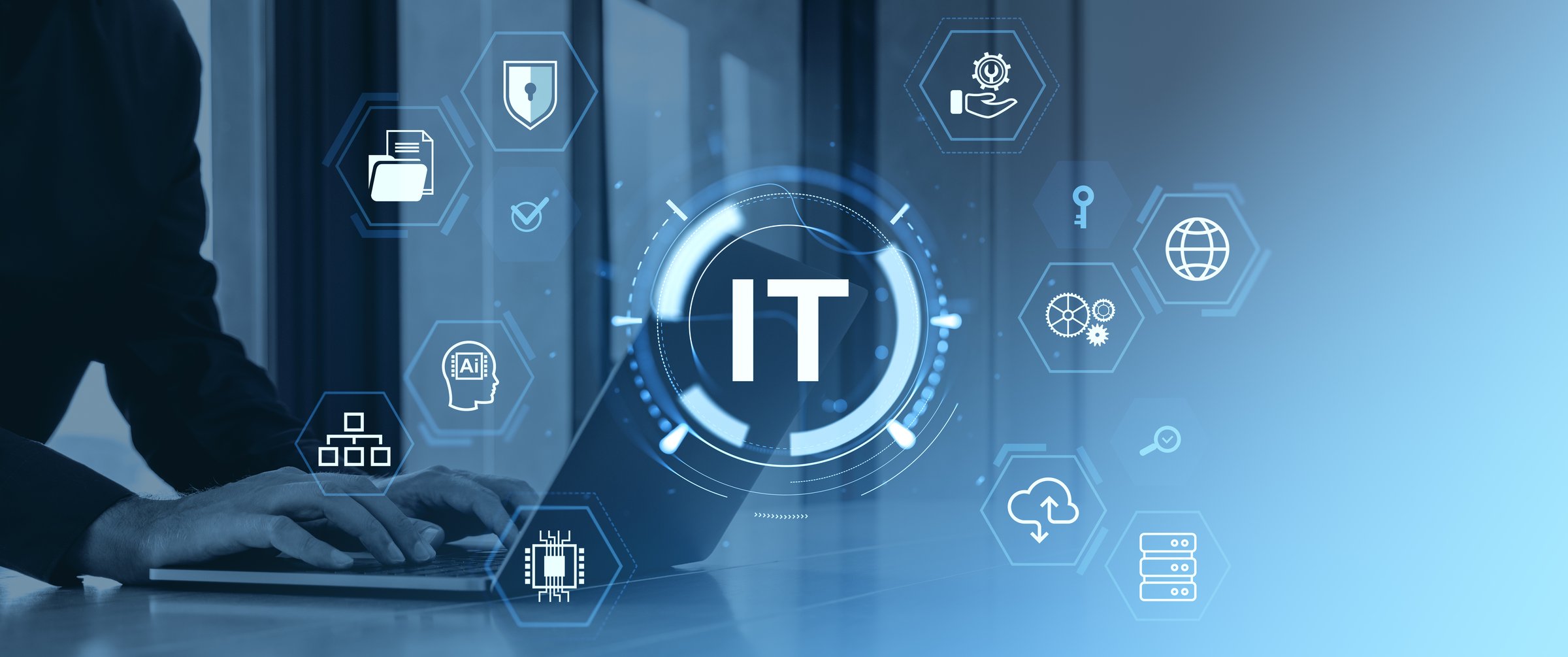 Person typing on laptop with futuristic IT icons and digital tech symbols overlay on a blue gradient background, concept of information technology