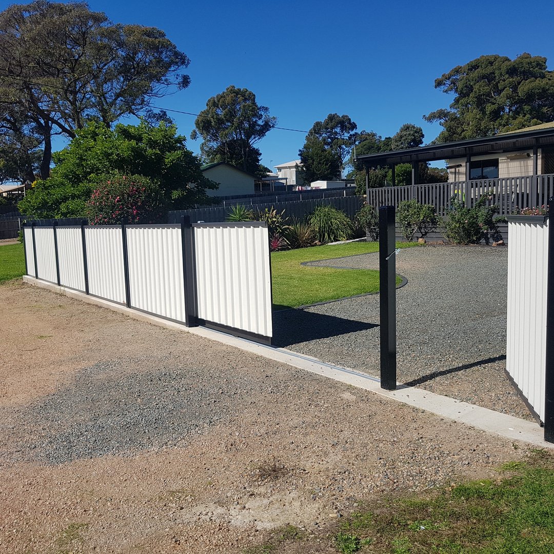 Professional Colorbond fence and automatic gate by The Fence Fixer