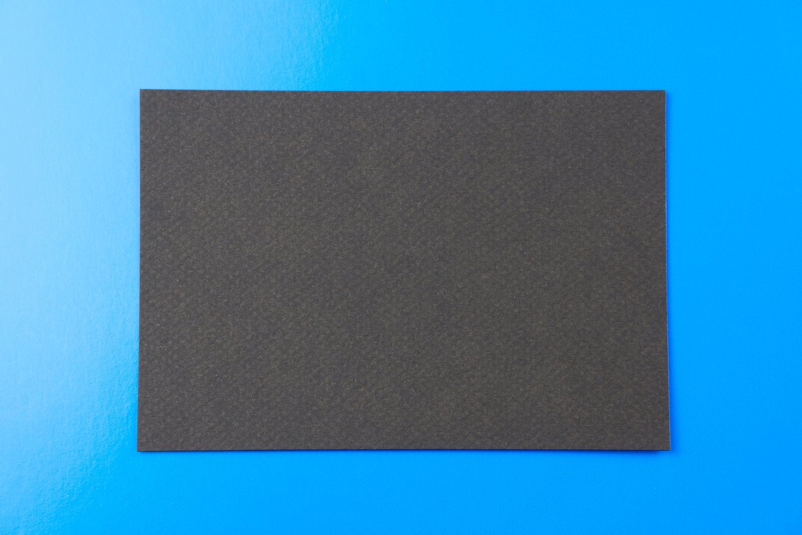 Black card on blue background