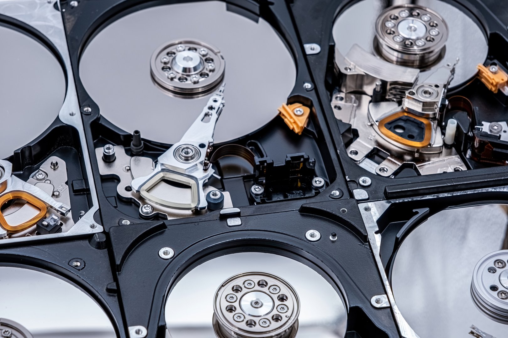 Disassembled hard drive from the computer, hdd with mirror effect. Opened hard drive from the computer hdd with mirror effects. Part of computer pc, laptop