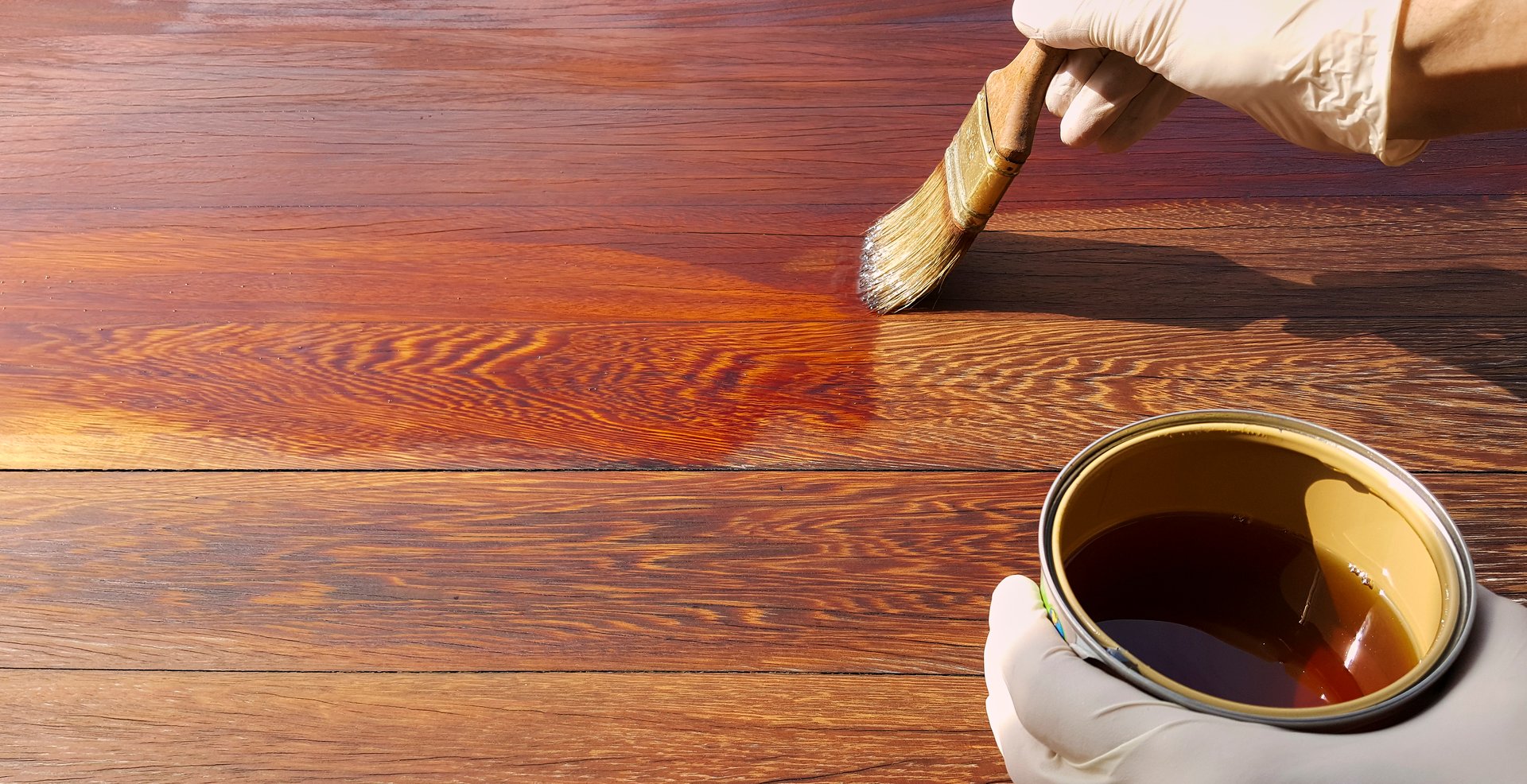 Painted wooden board with transparent protective water-based finish. House renovation works.