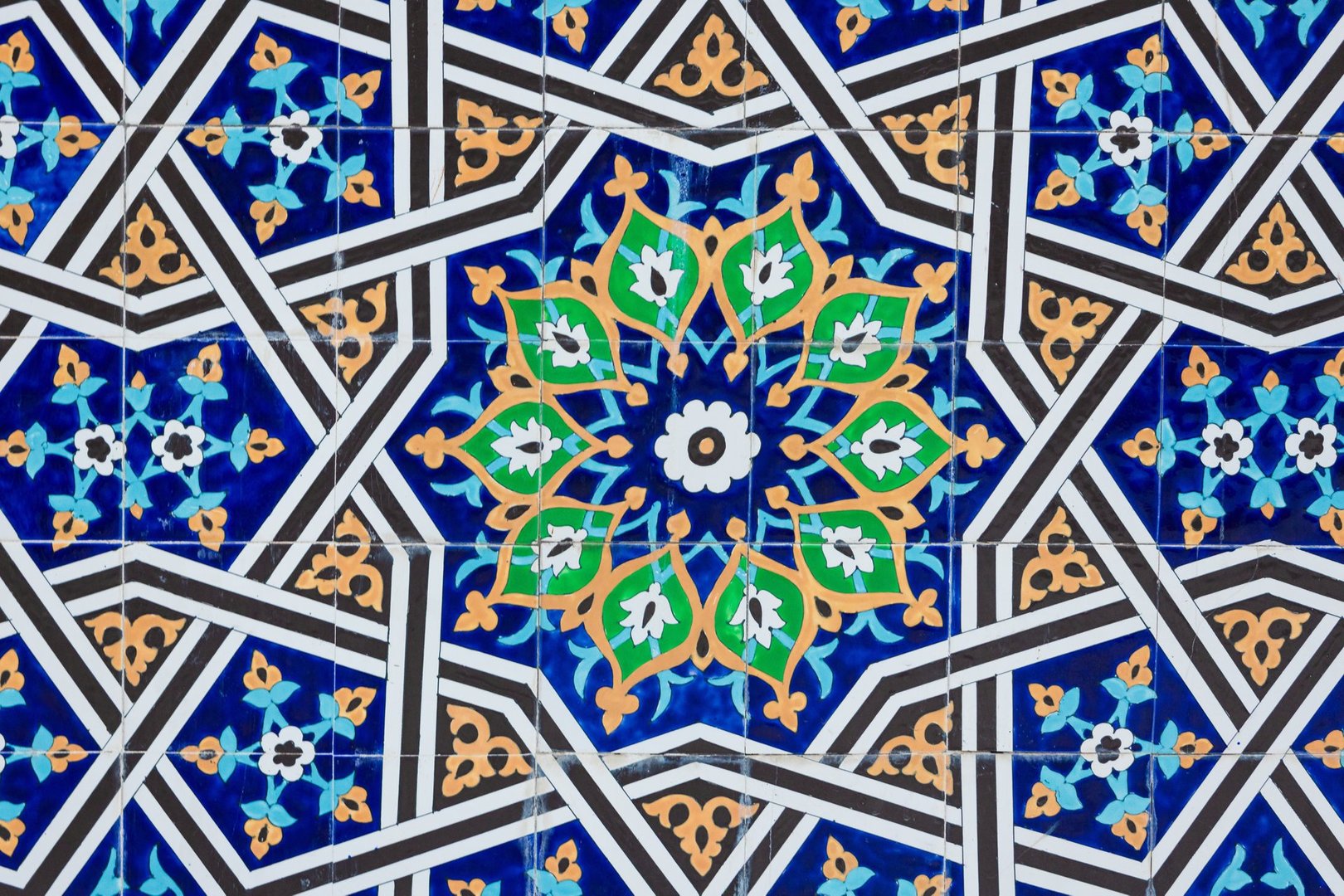 Background with traditional uzbek geometric floral ornament on ceramic tile. Oriental pattern mosaic