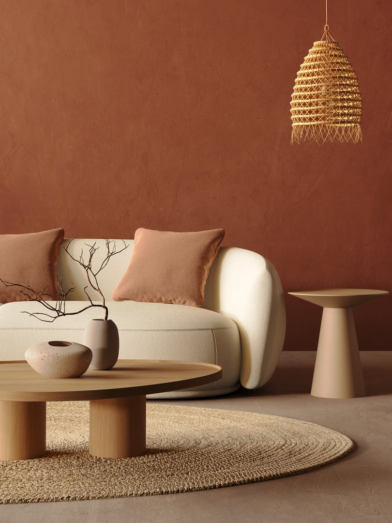 3d render of a contemporary interior with beige lounge sofa, side table and table  lamp over red wall