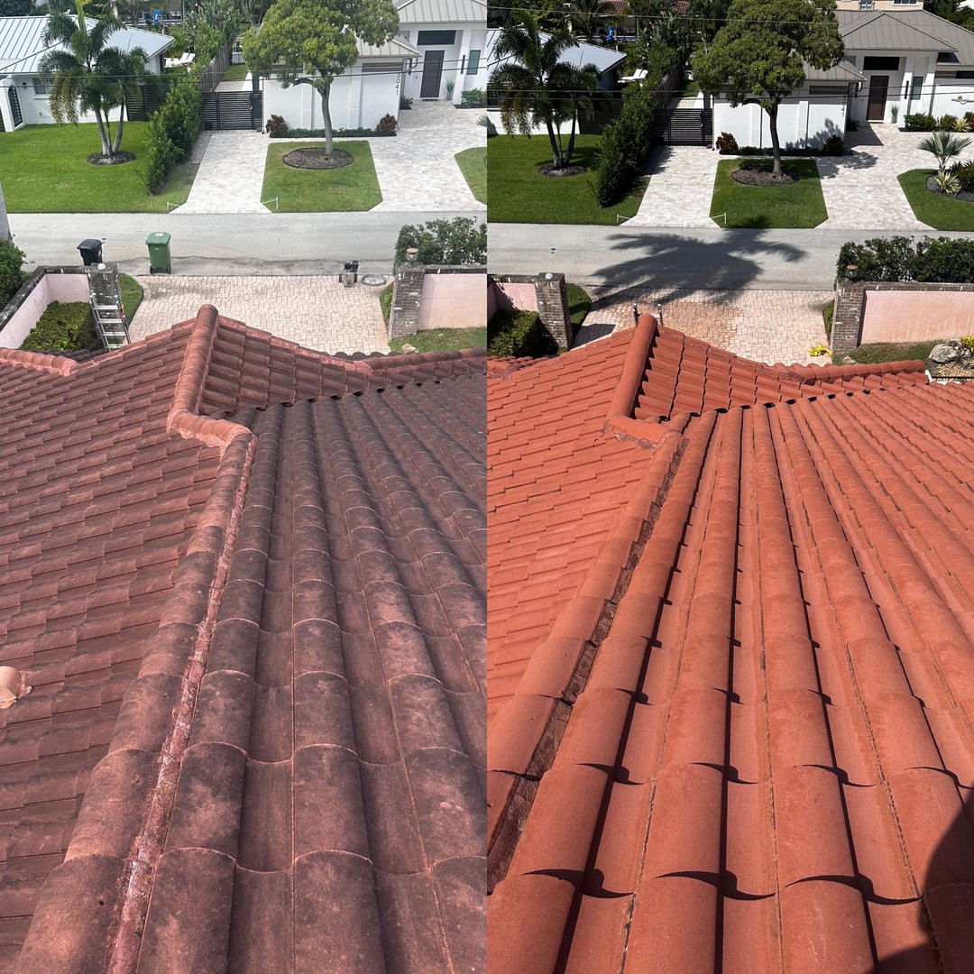 Worker cleaning roof tiles