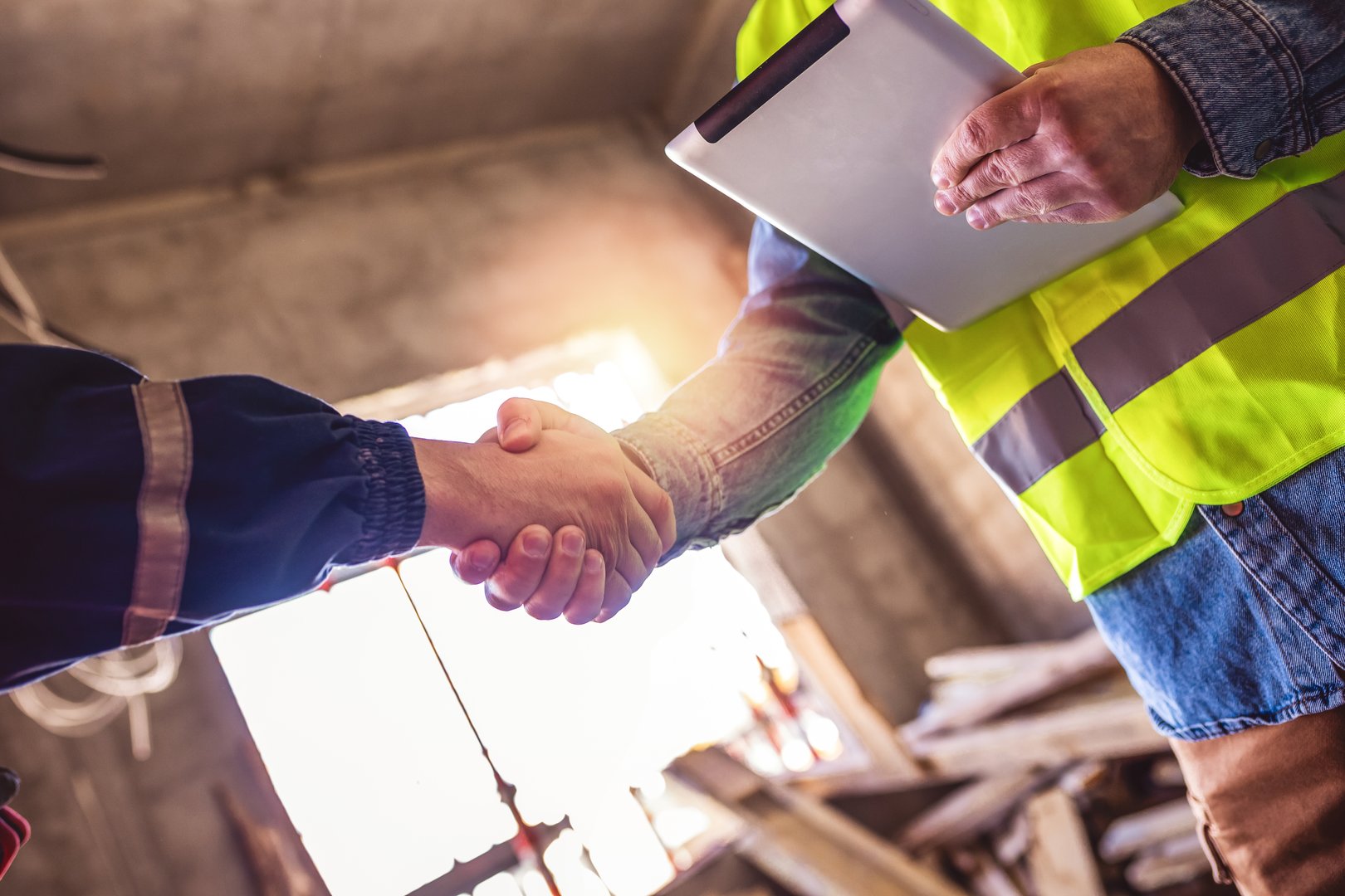Contractor. construction worker team hands shaking after plan project contract  at construction site, contractor, engineering, partnership, construction concept