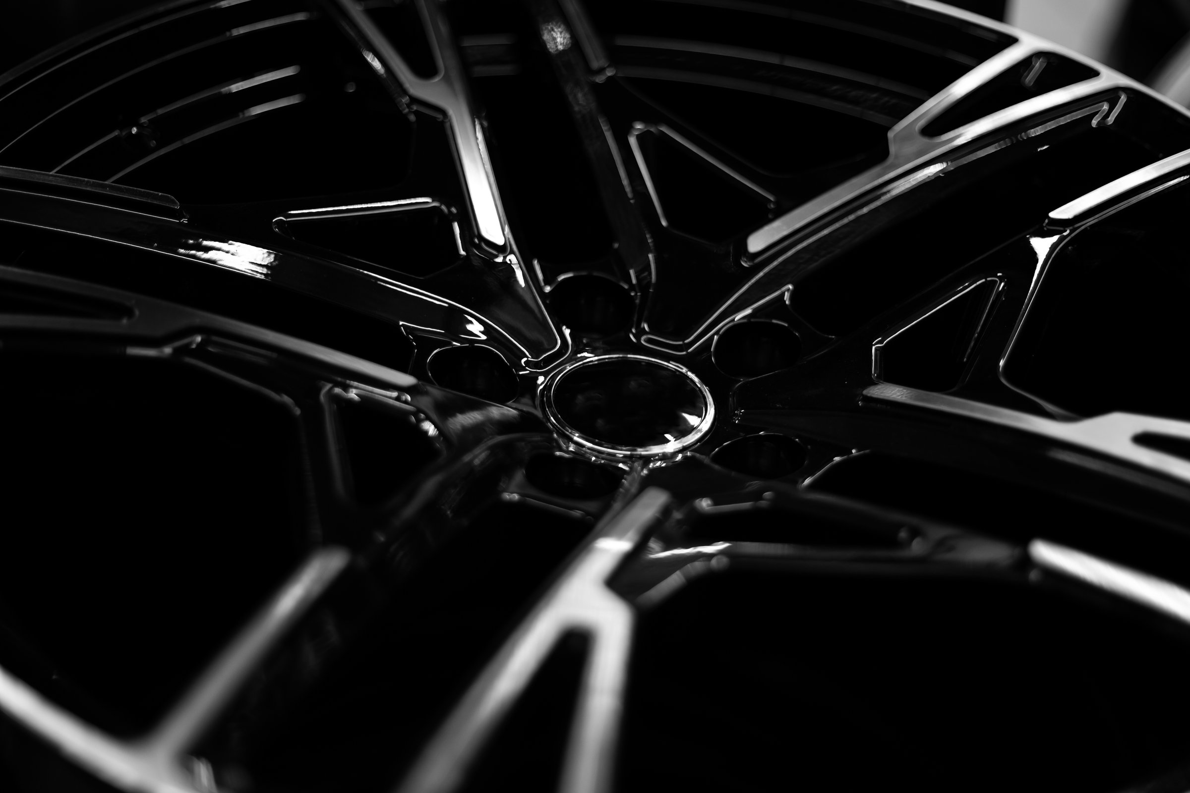Black alloy wheels for premium cars, close-up. Purchase and replacement of autodisks.