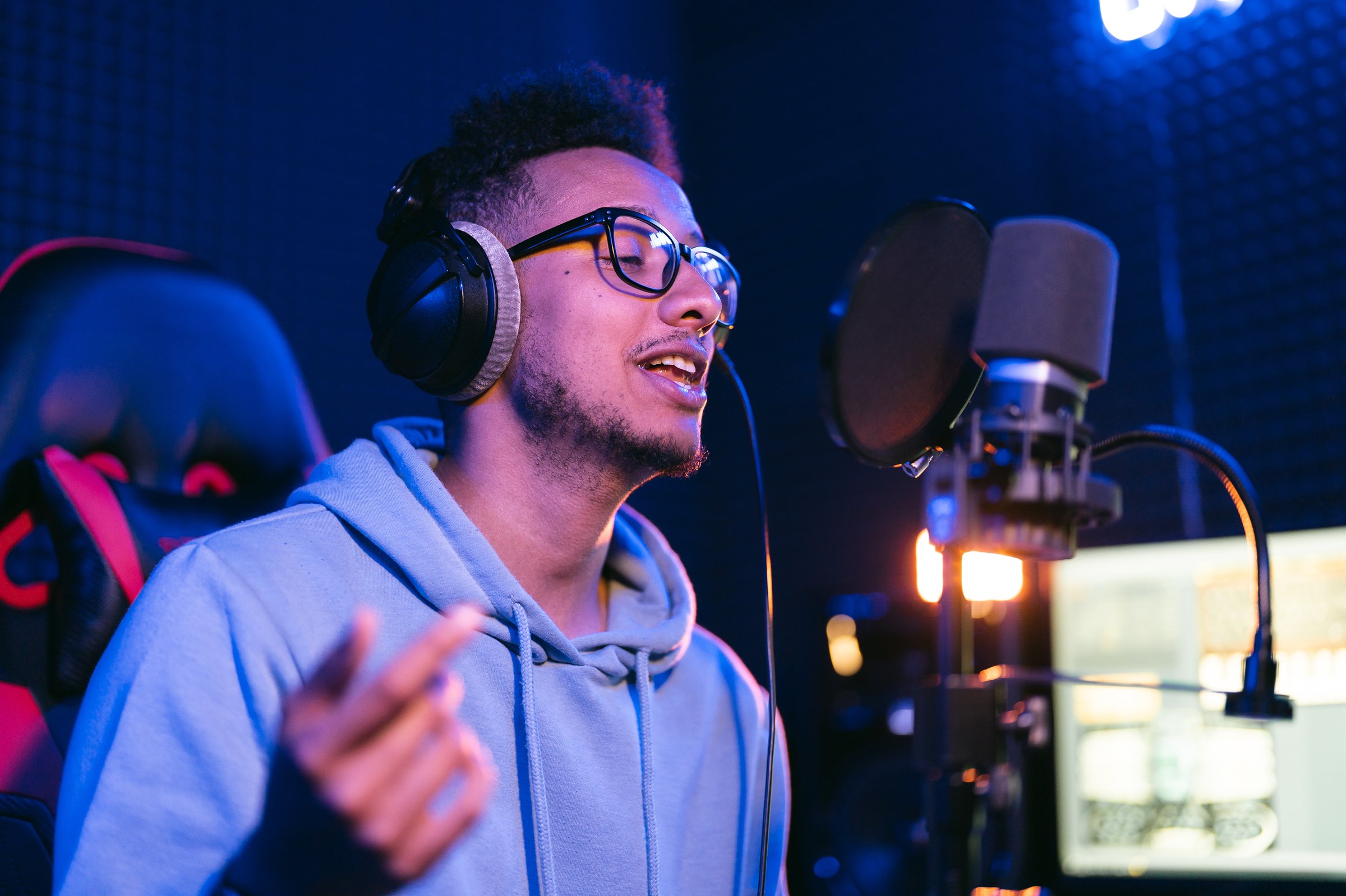 Creative man singing in sound studio