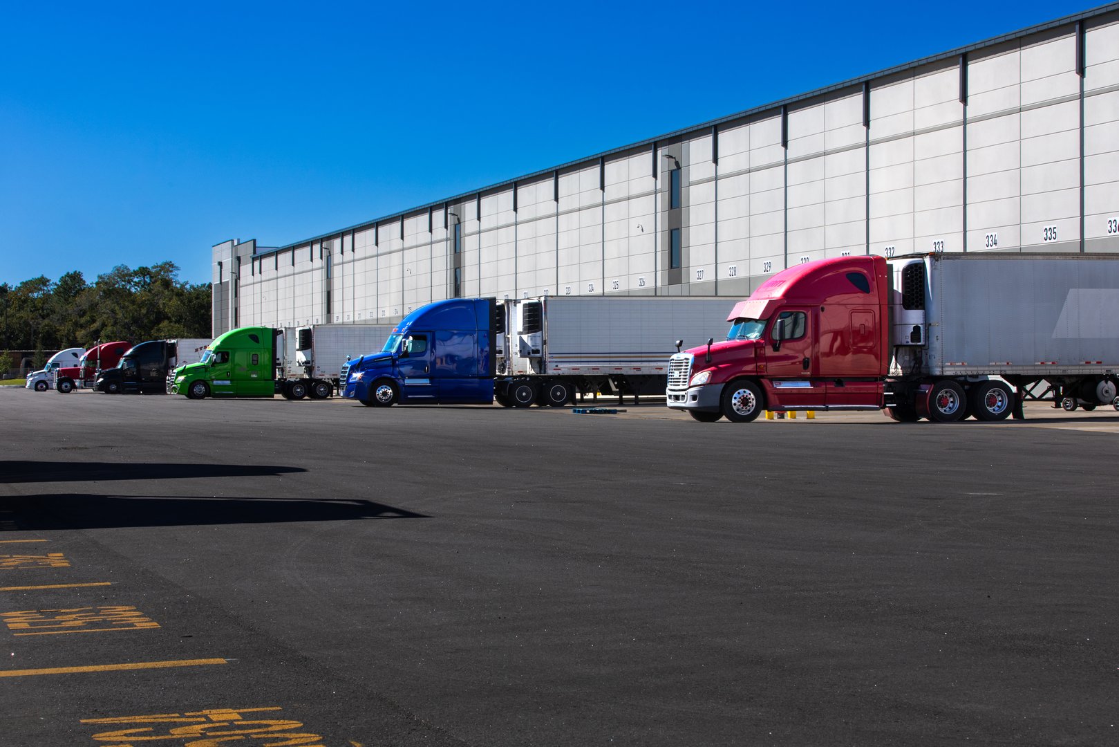Logistics warehouse loading dock with trucks