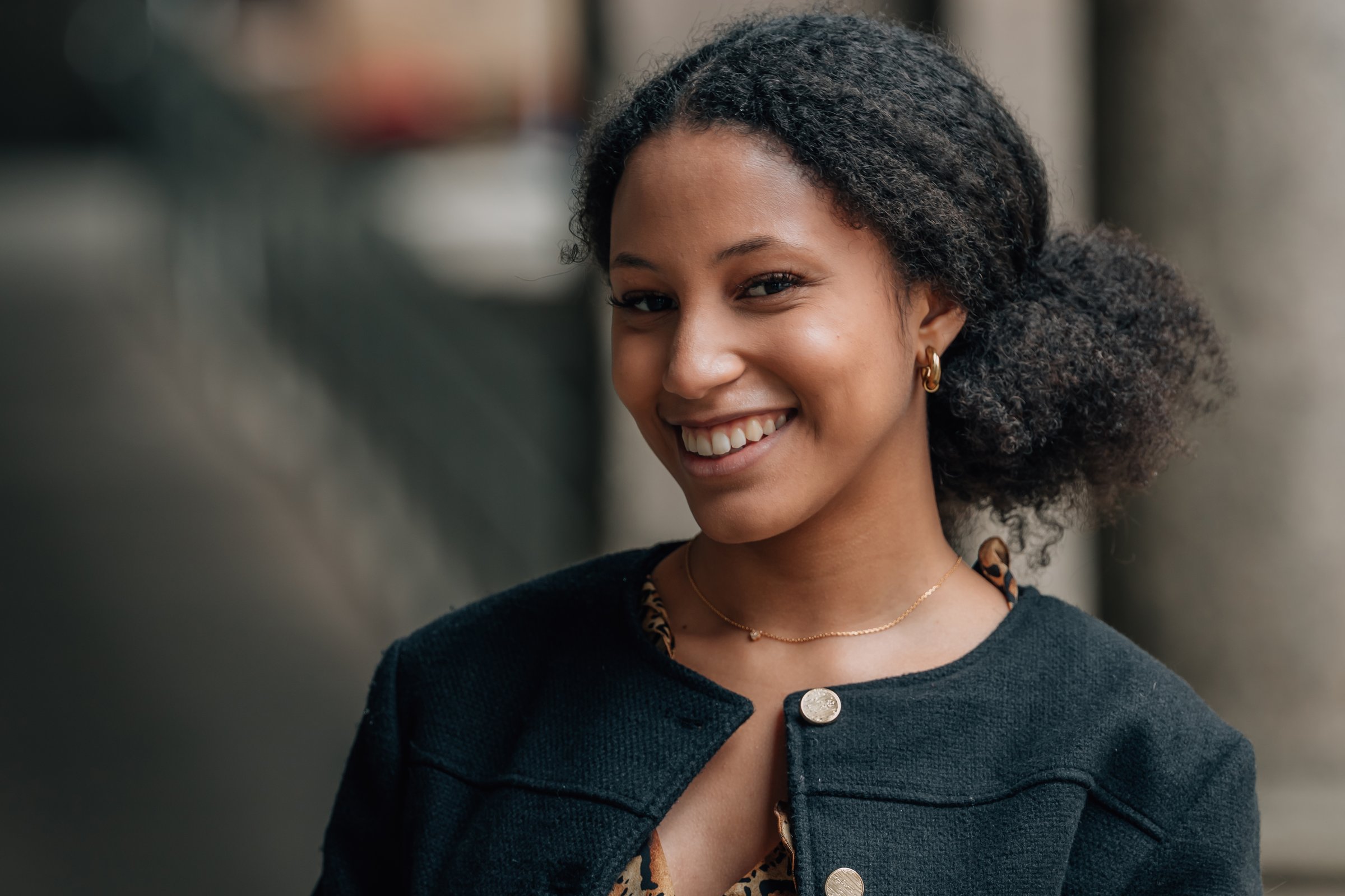 portrait of a young hispanic latin american woman on the street