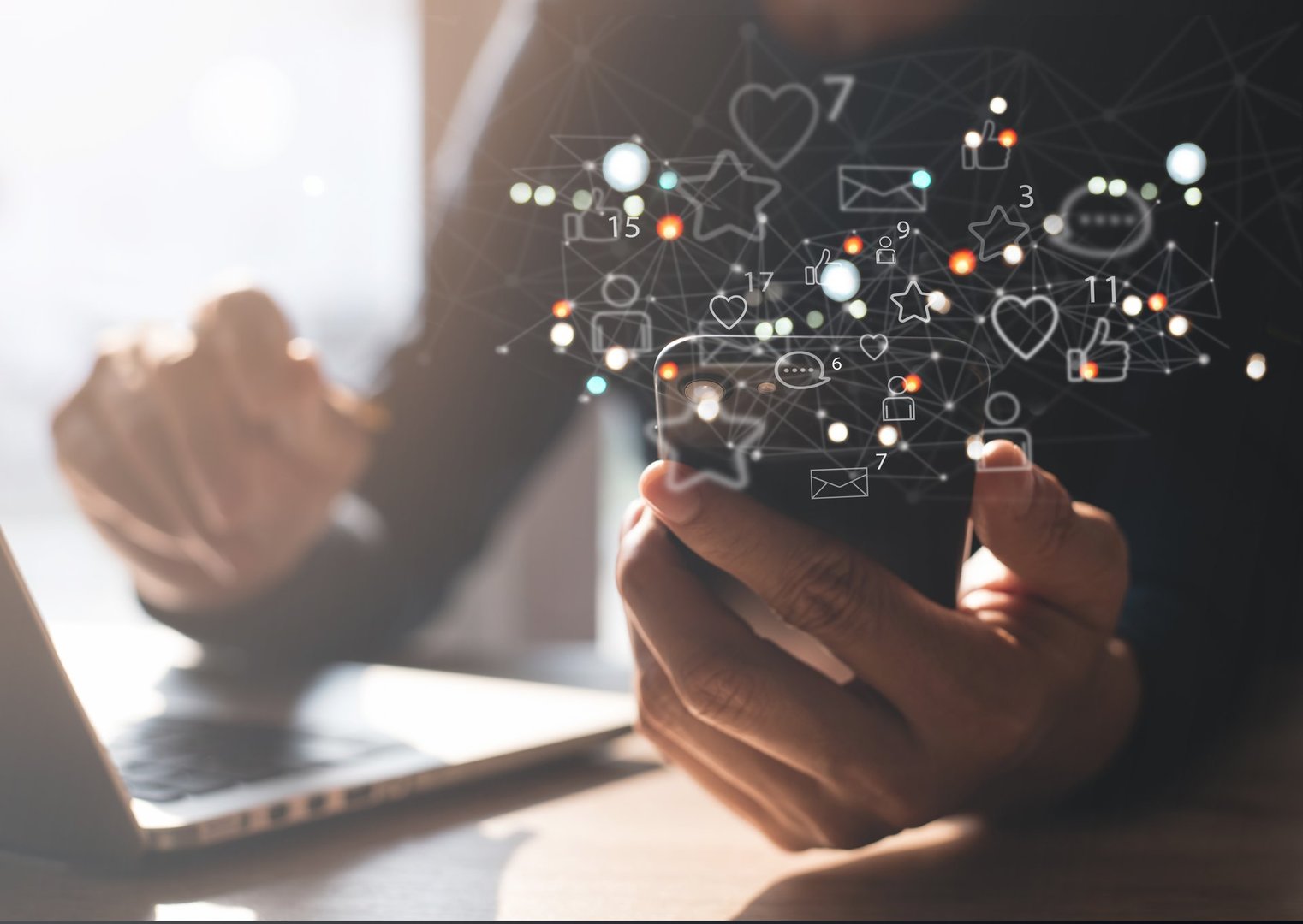 Man using mobile phone with social media apps icons on virtual screen, social media, digital marketing, online shopping via mobile app, online business strategy, ppc pay per click concept