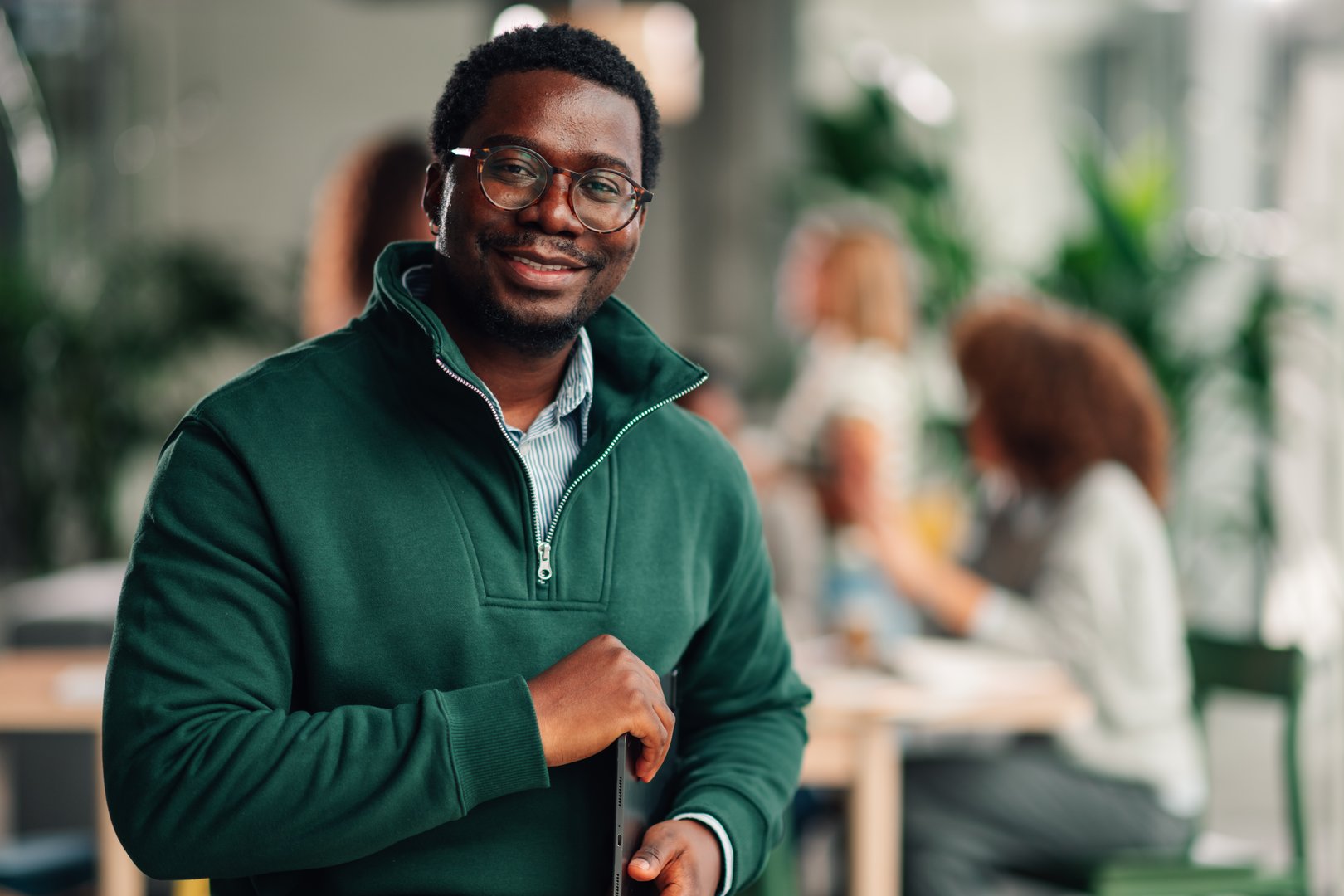 Confident african american businessman smiling at camera