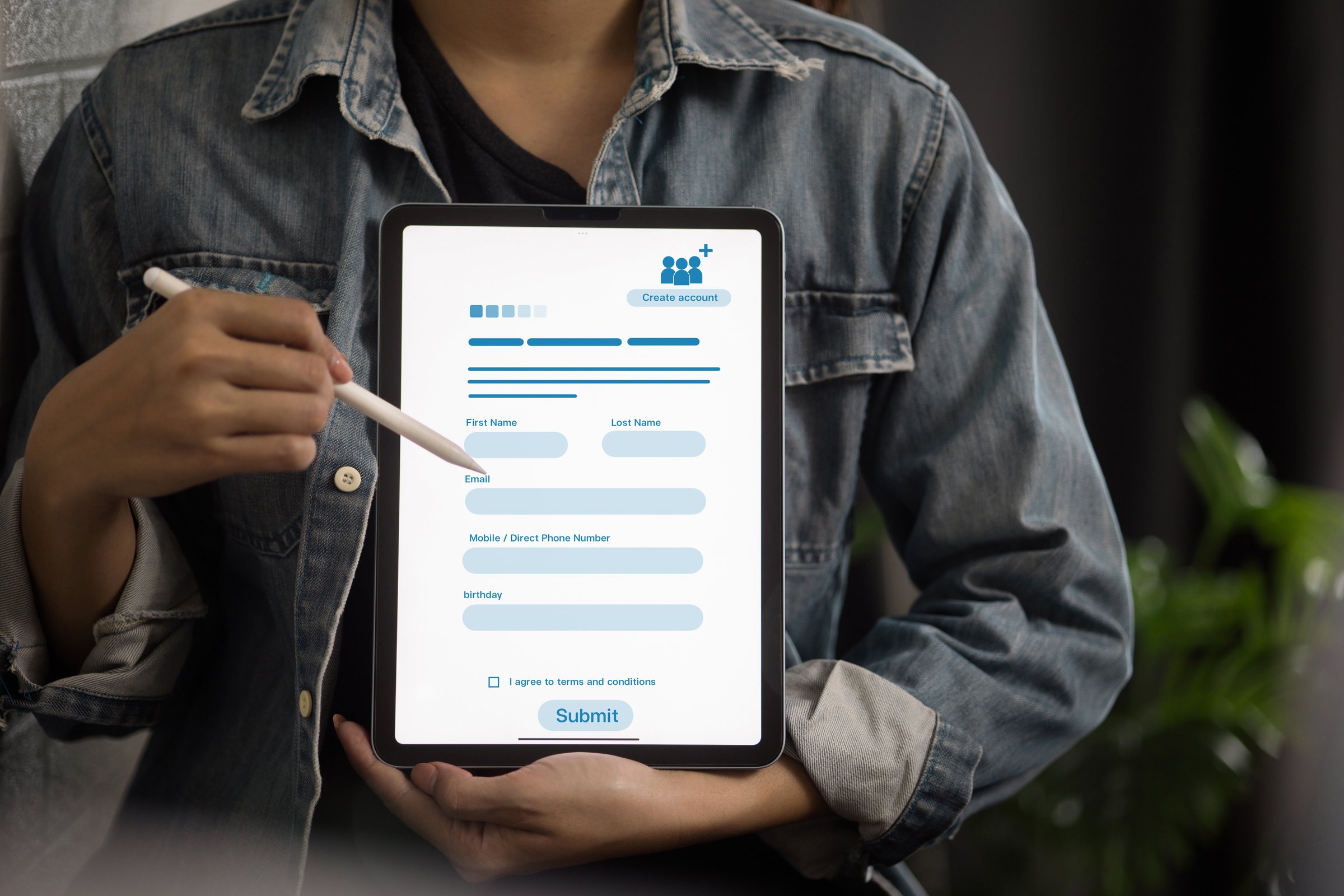 Close-up of woman using stylus on tablet with digital registration form for online account creation. Modern technology, user interface, business concept.