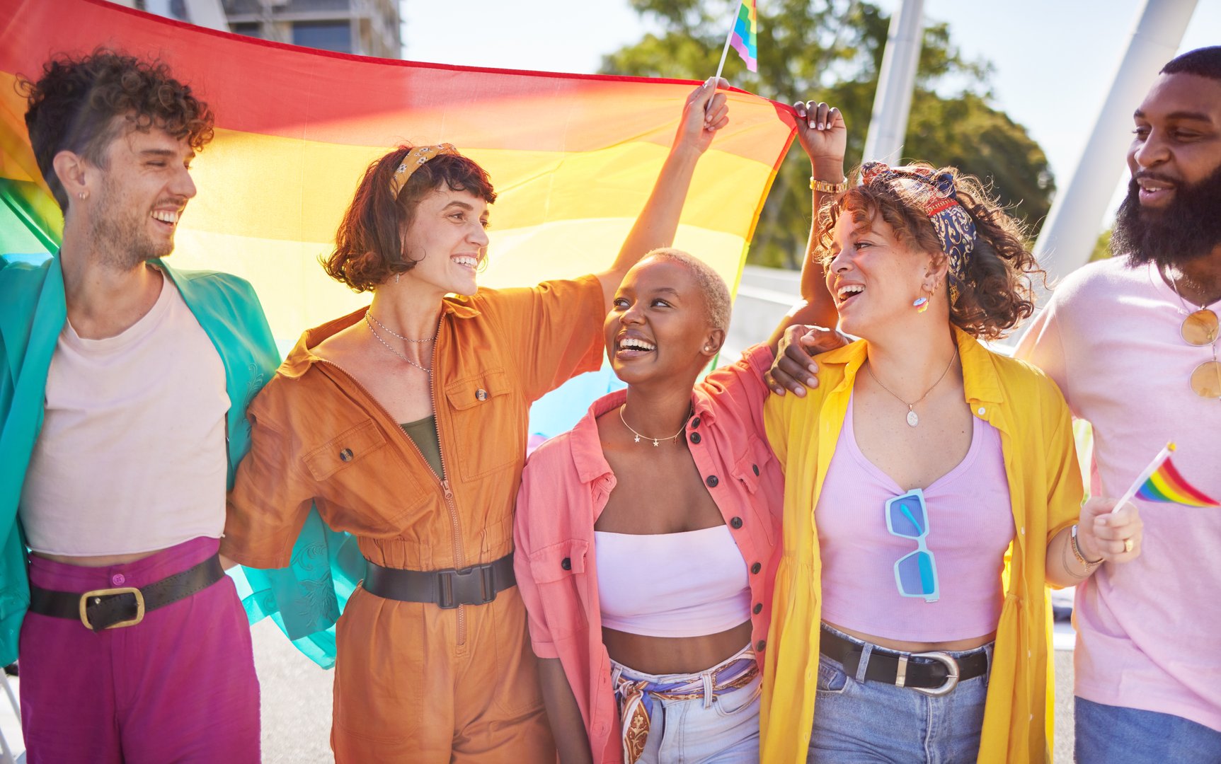LGBT friends celebrating pride with rainbow flags