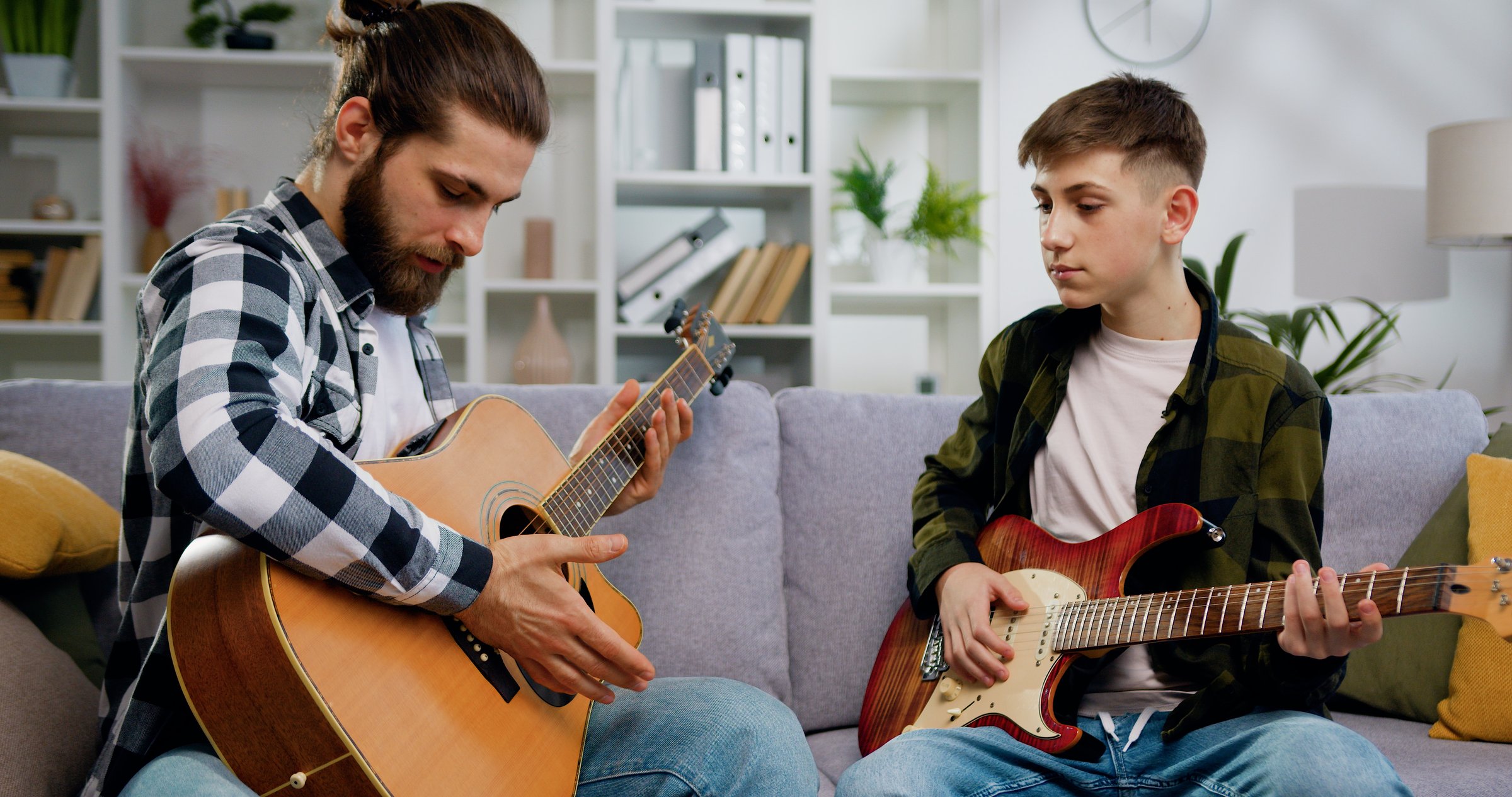 Guitar lesson with teacher and student