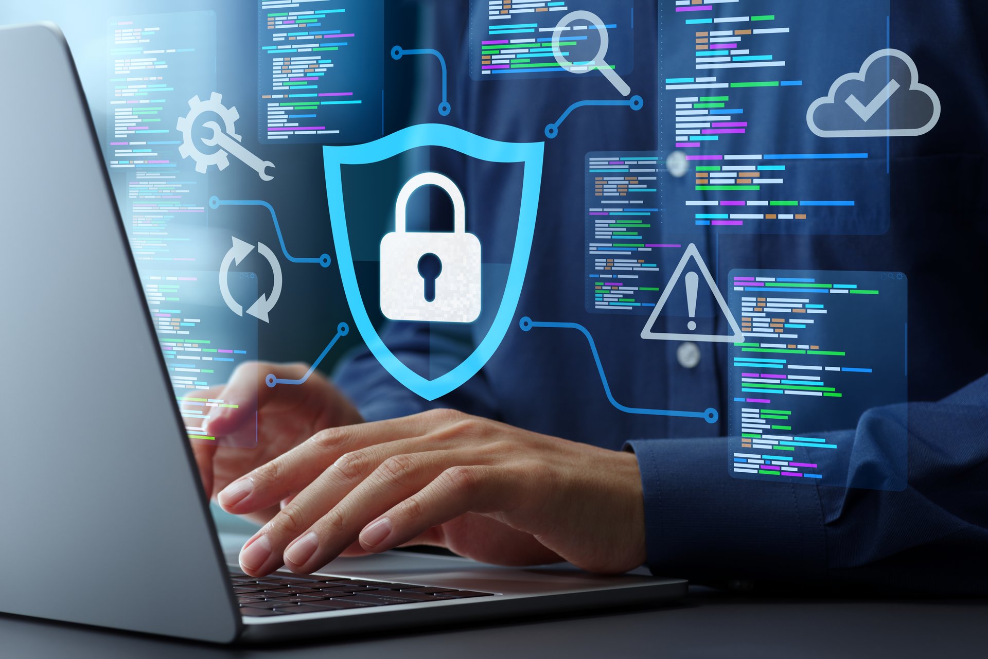 Programmer using laptop to develop applications