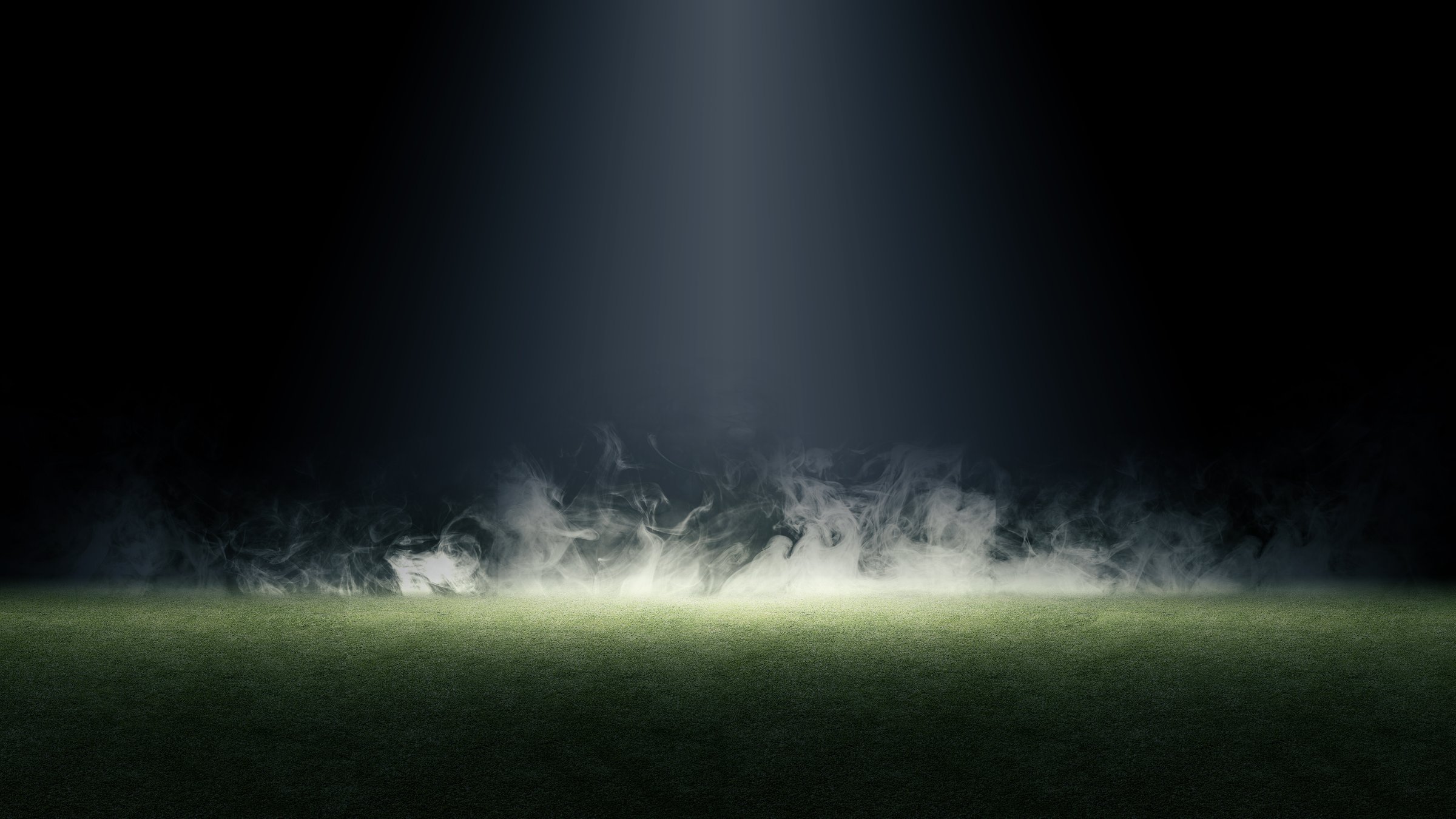 Surface of green grass. Abstract texture with smoke, mist or fog. Mockup or template. Copy space. Dark background