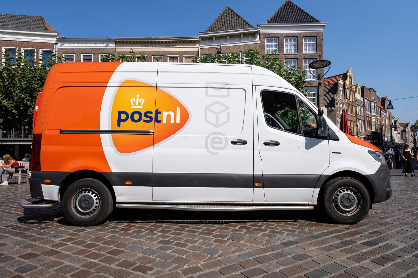 Zwolle, Netherlands -September 5, 2024: PostNL Mercedes-Benz Sprinter delivery van in the city center of Zwolle
