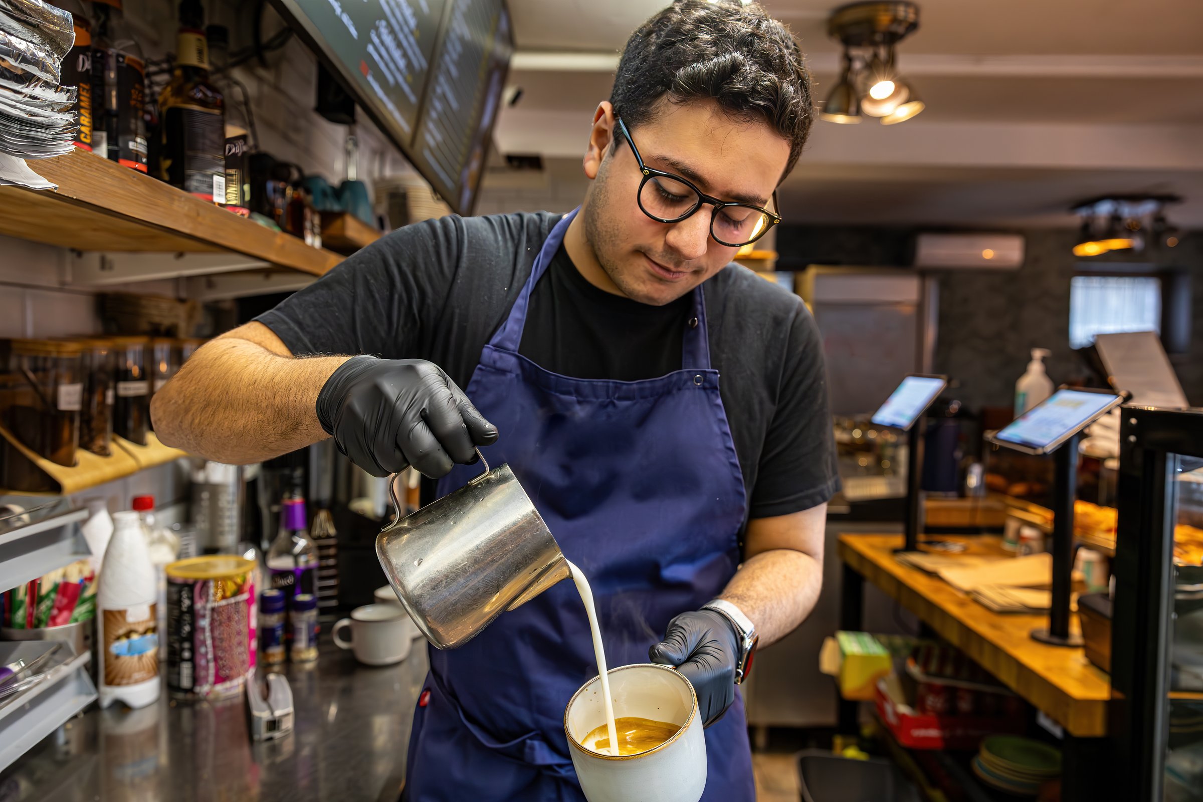 Stockholm, Sweden A young male barista in a coffee shop or cafe.