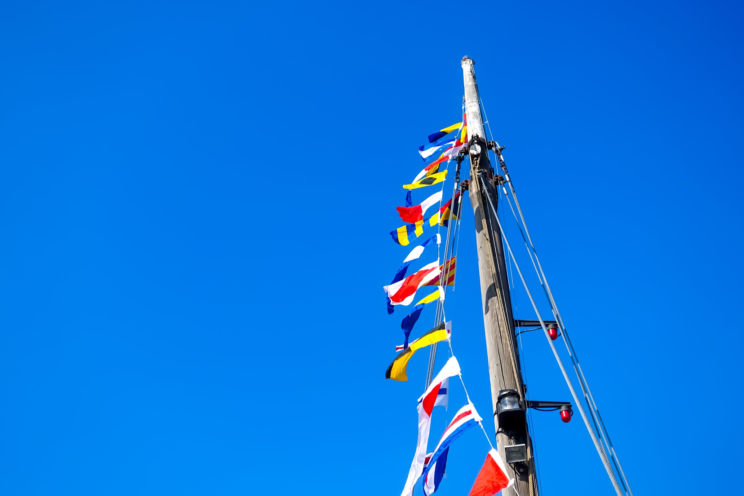 Nautical concept with signal flags according to IMO standards used to communicate between ships