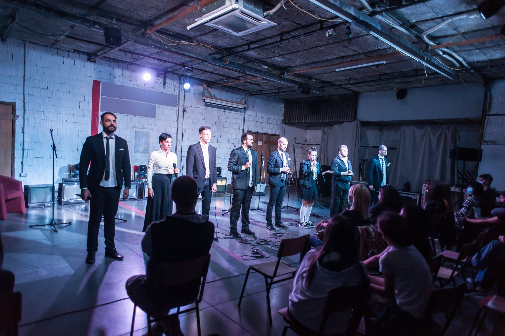 Large group of theater actors performing