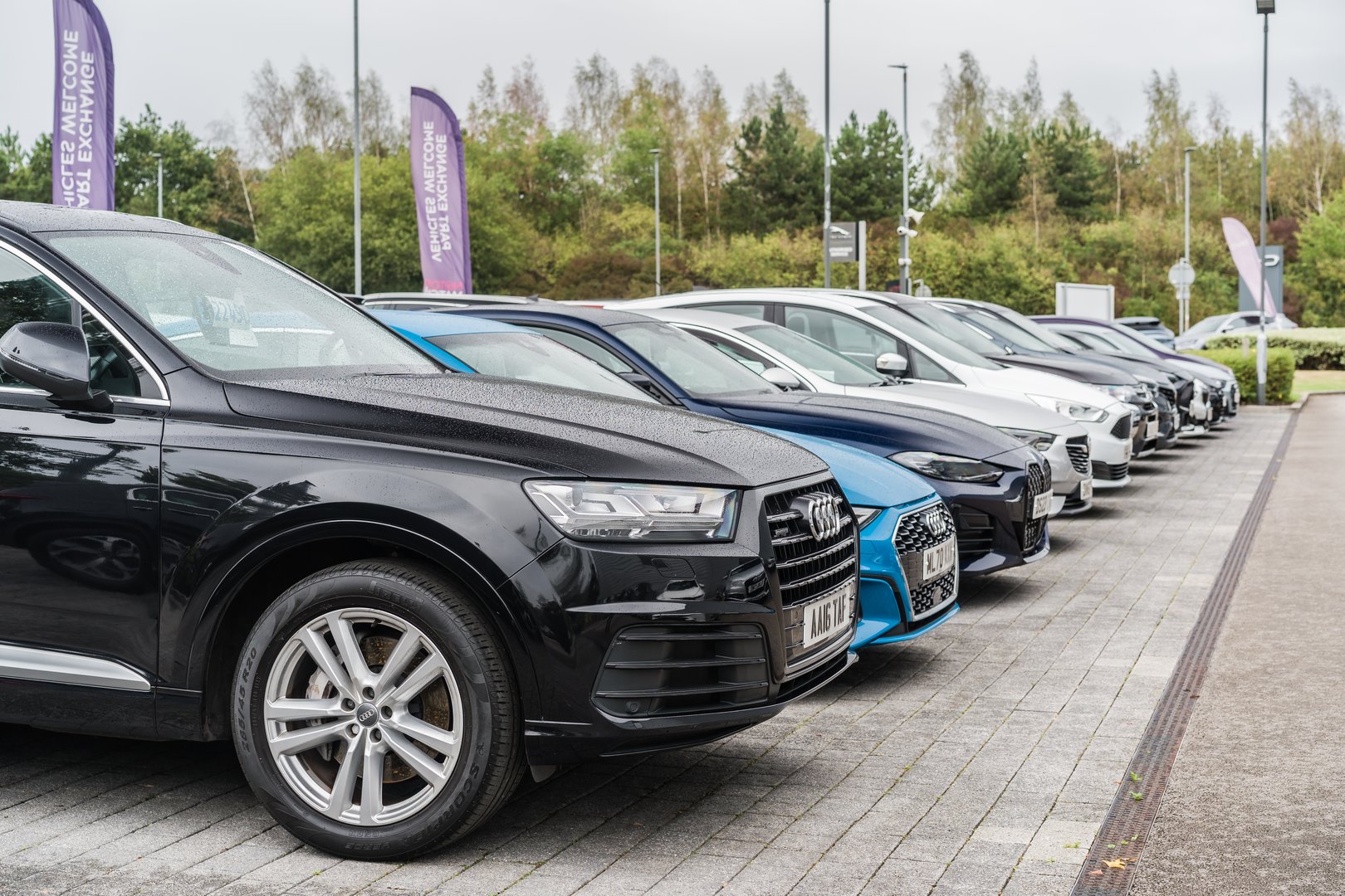 Crewe, Cheshire, England, August 30th 2025. A row of cars are parked on a showroom forecourt.