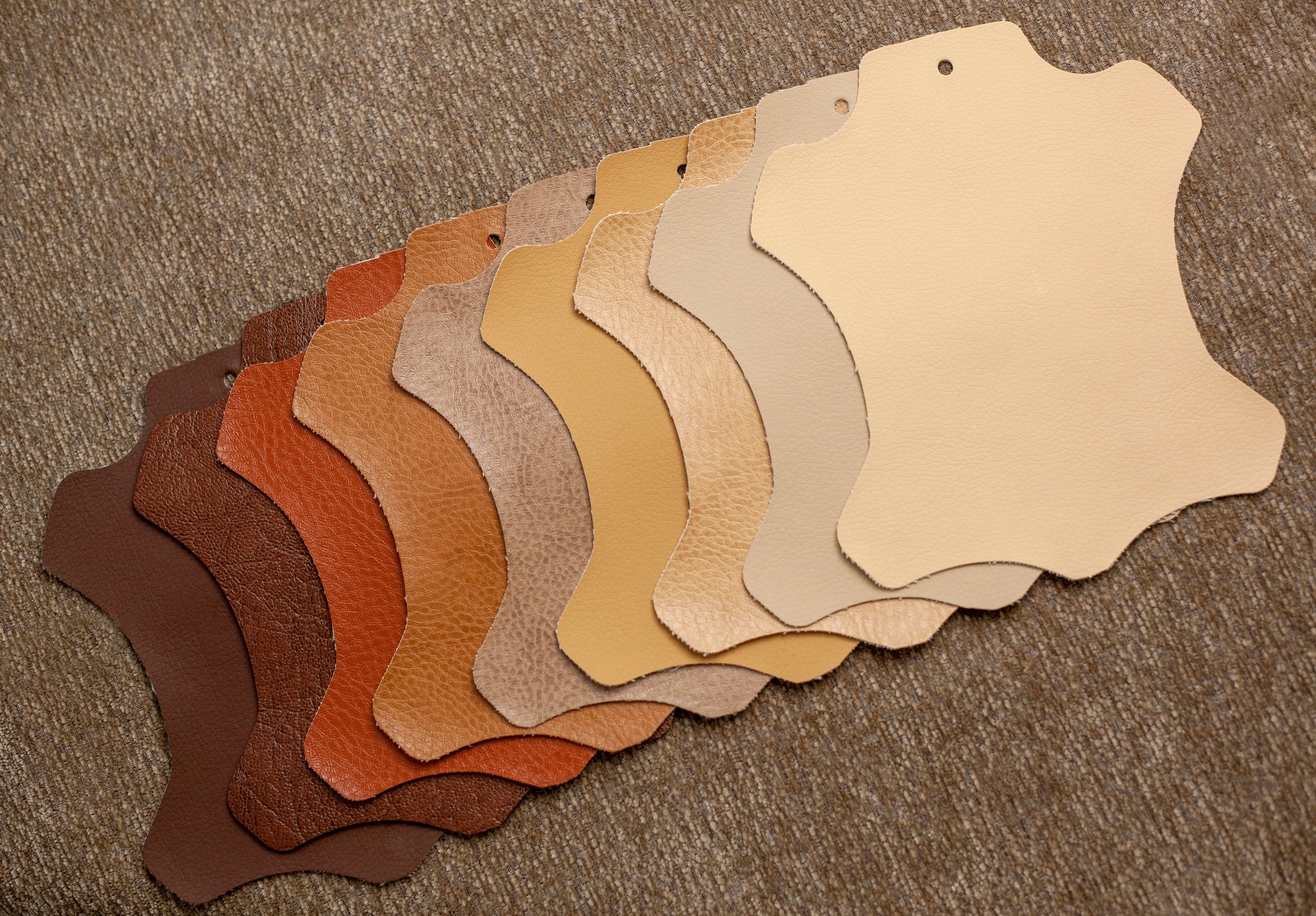 Artificial leather in various shades of brown. catalog of brown leather samples. Artificial leather or dermatin for the manufacture of upholstered furniture, shoes or bags.